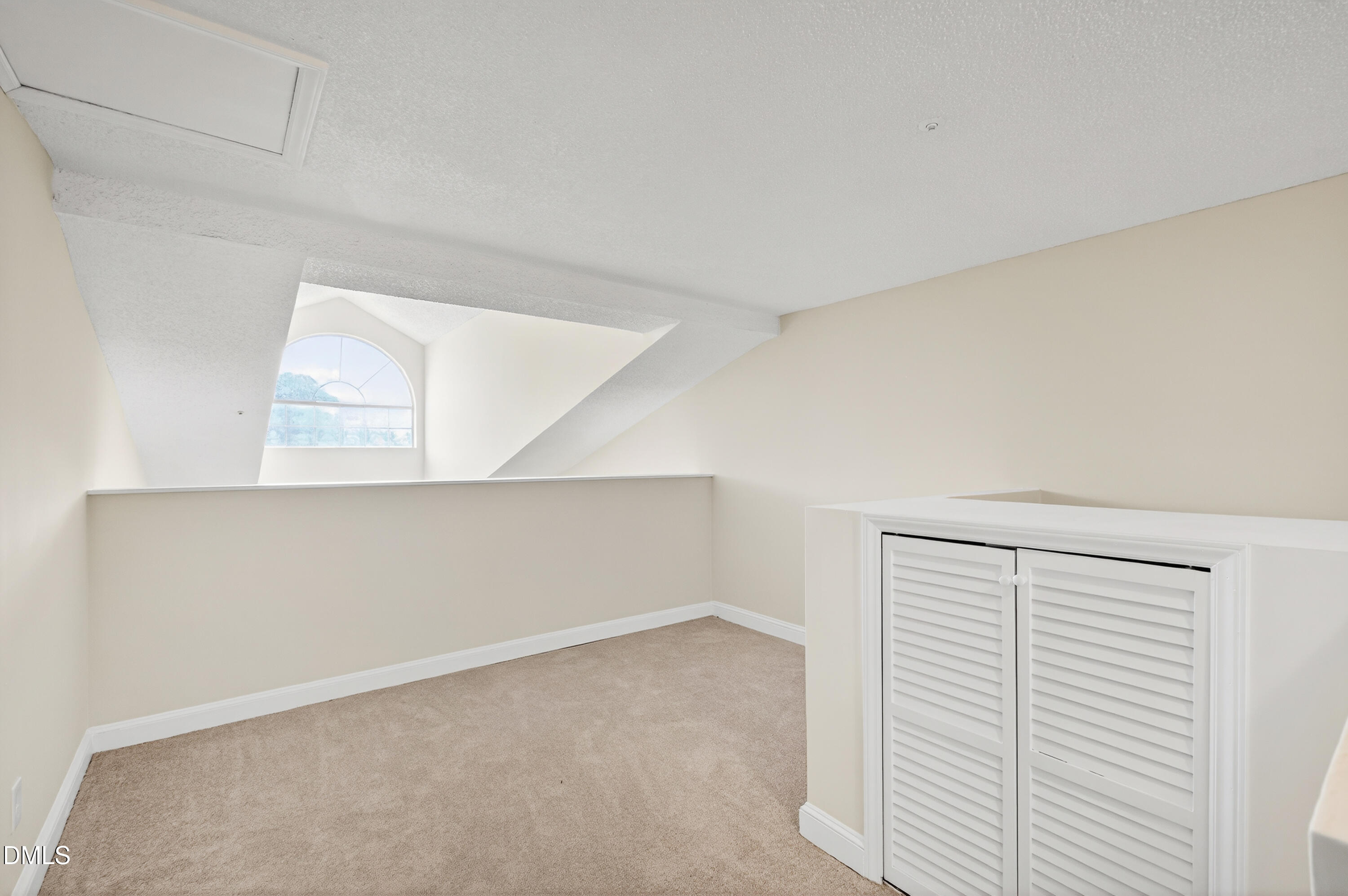 4921 Hollenden Drive, Unit 303 Raleigh, NC 27616 - Photo 27 of 33 a view of an empty room