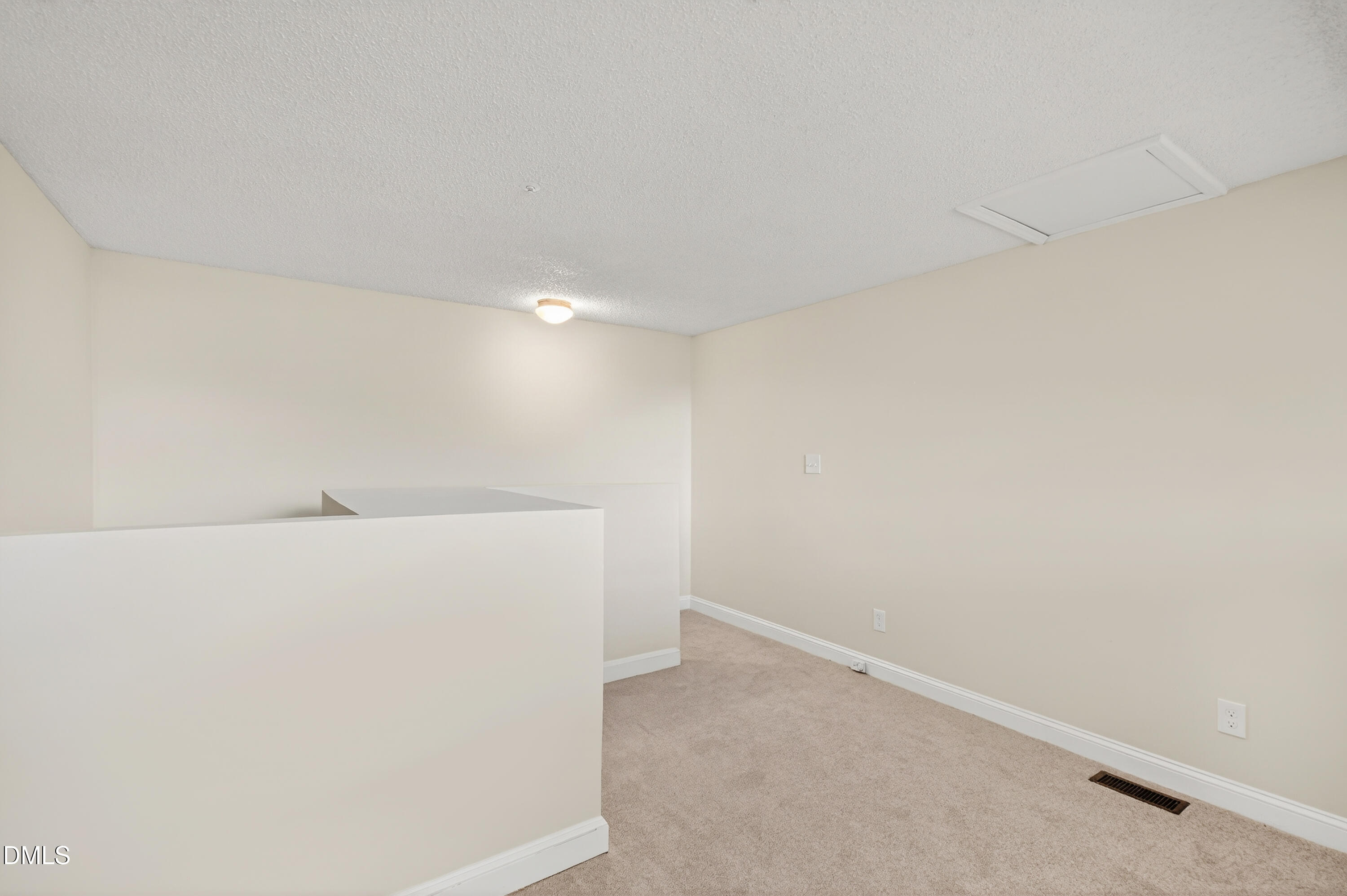 4921 Hollenden Drive, Unit 303 Raleigh, NC 27616 - Photo 29 of 33 a view of an empty room
