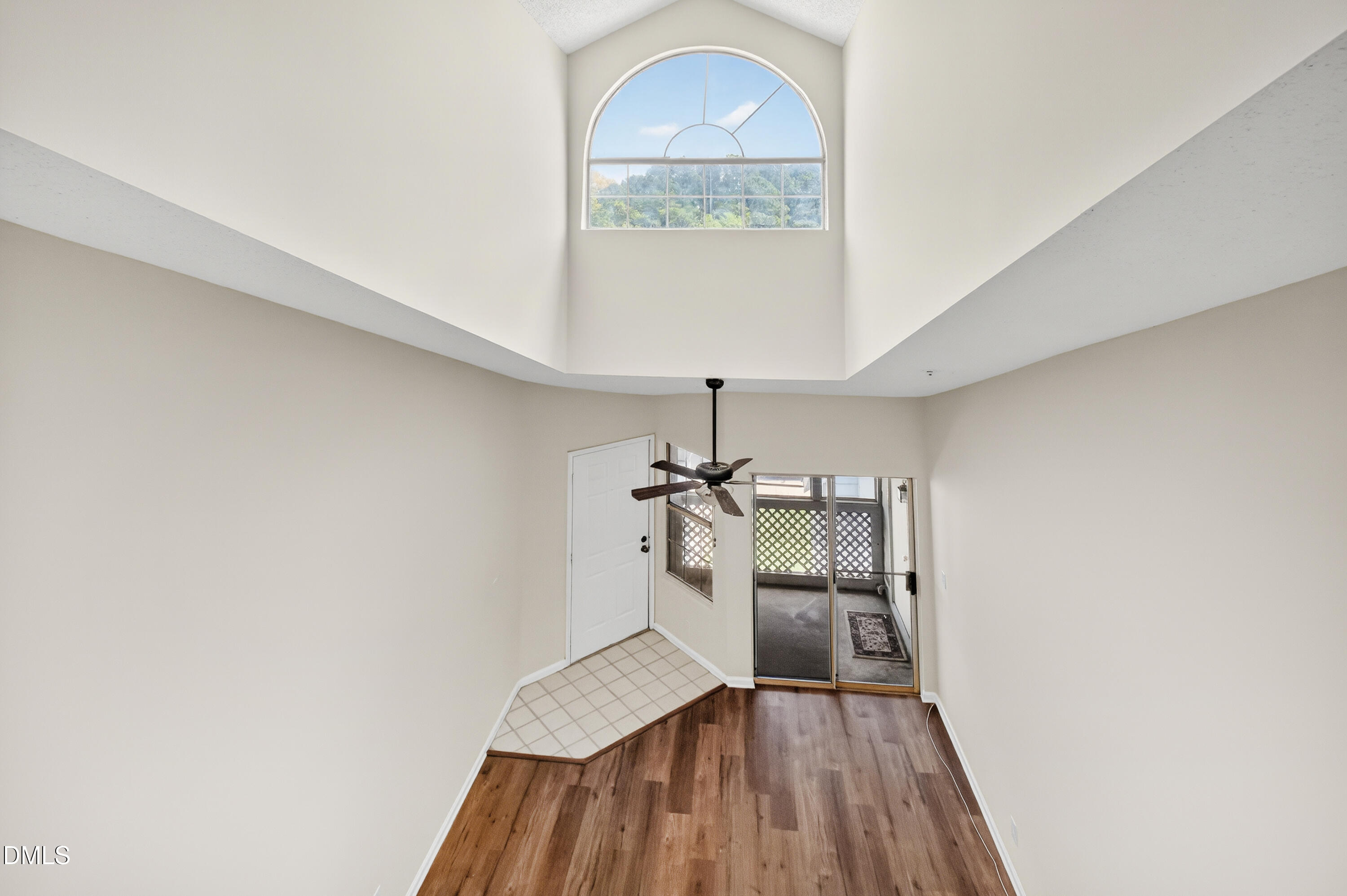4921 Hollenden Drive, Unit 303 Raleigh, NC 27616 - Photo 4 of 33 a view of a room with wooden floor staircase and a hallway