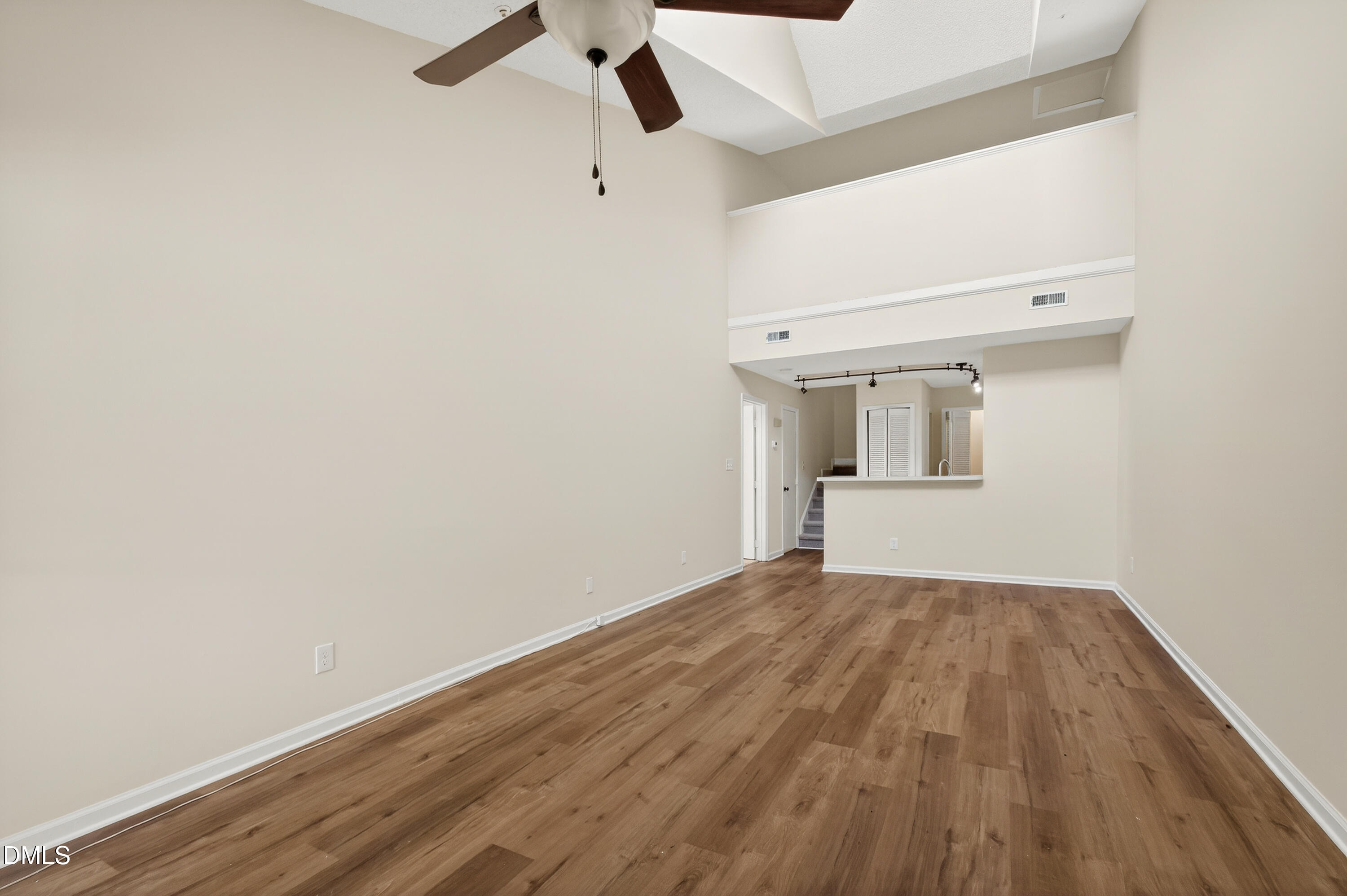 4921 Hollenden Drive, Unit 303 Raleigh, NC 27616 - Photo 5 of 33 a view of empty room with wooden floor