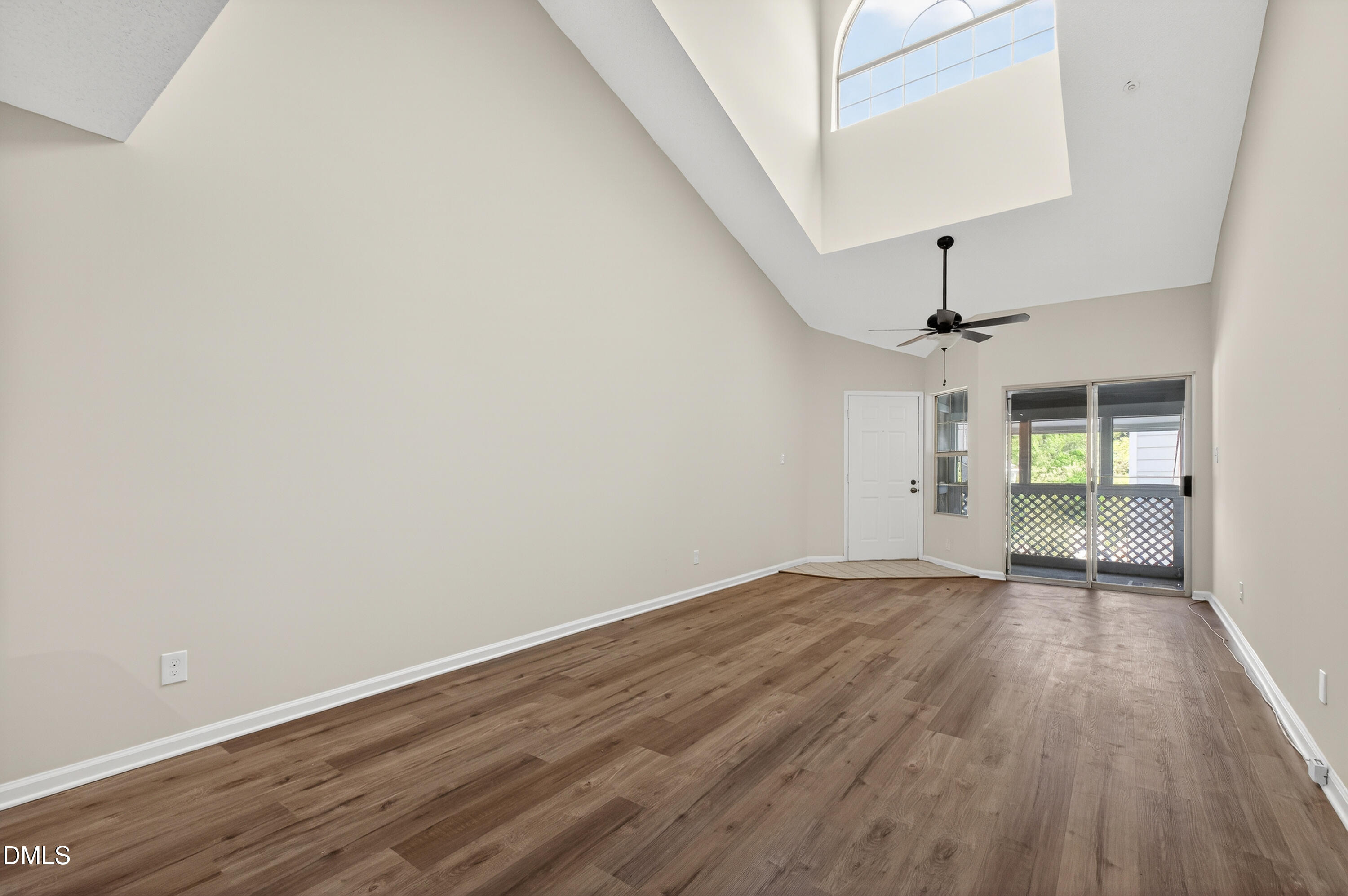 4921 Hollenden Drive, Unit 303 Raleigh, NC 27616 - Photo 8 of 33 a view of empty room with wooden floor