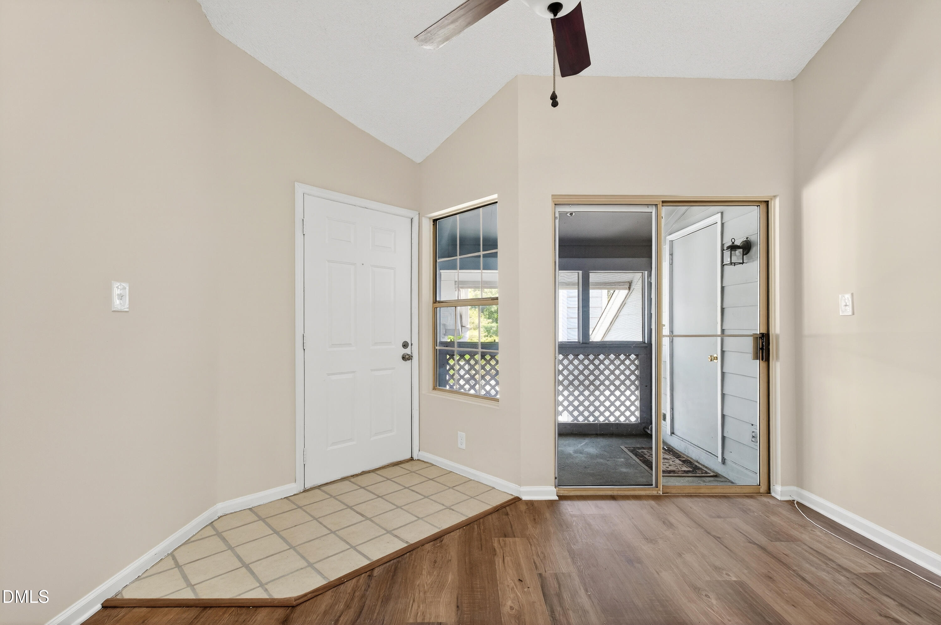 4921 Hollenden Drive, Unit 303 Raleigh, NC 27616 - Photo 10 of 33 an empty room with windows