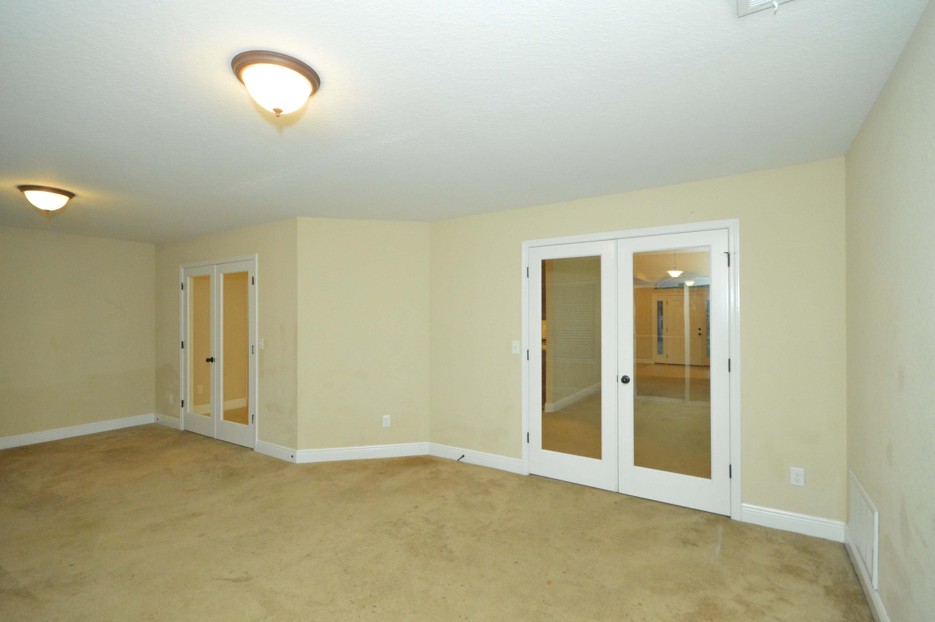9970 Nichols Lake Road Milton, FL 32583 - Photo 13 of 48 an empty room with windows