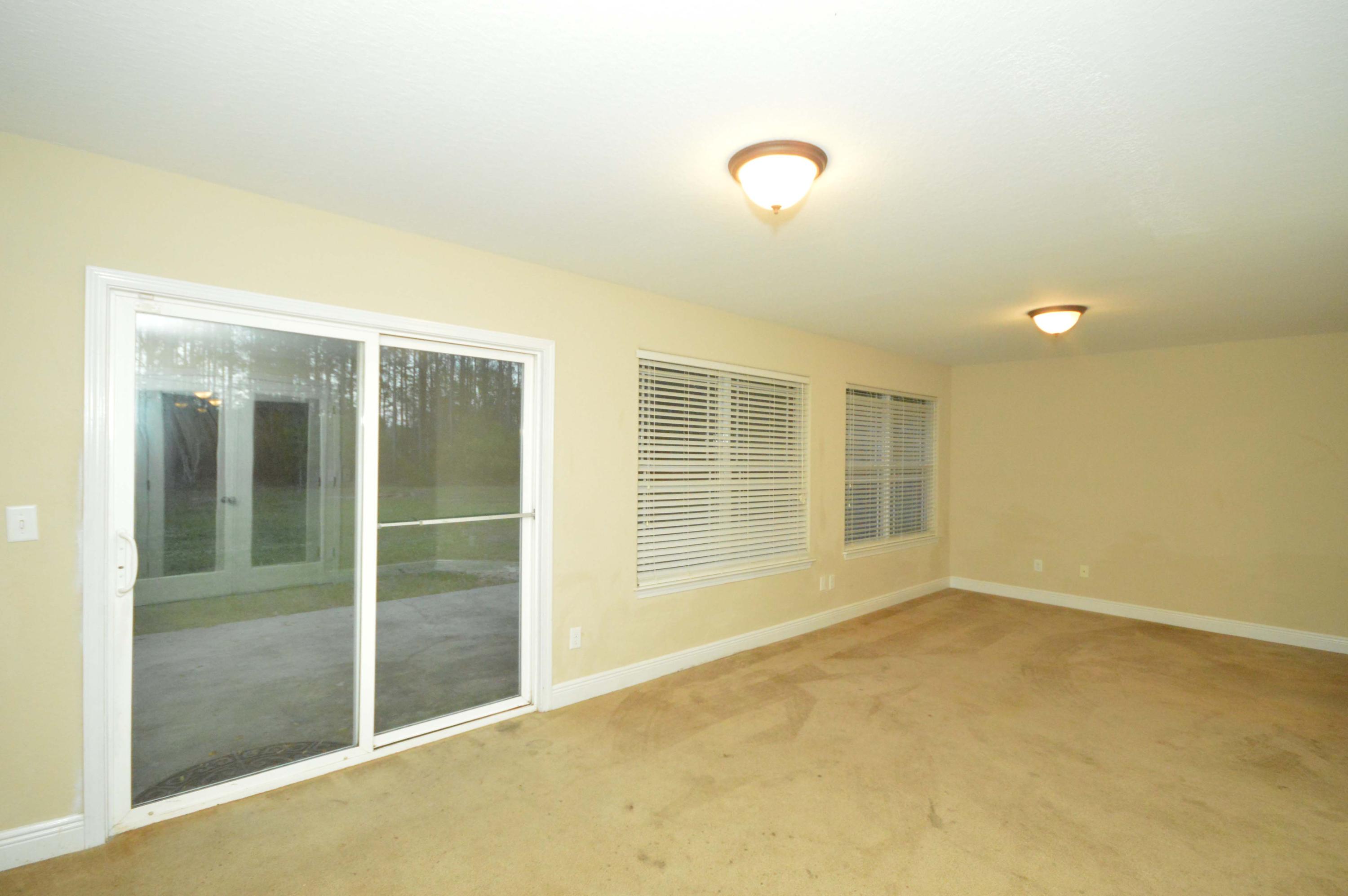 9970 Nichols Lake Road Milton, FL 32583 - Photo 14 of 48 a view of an empty room with a window