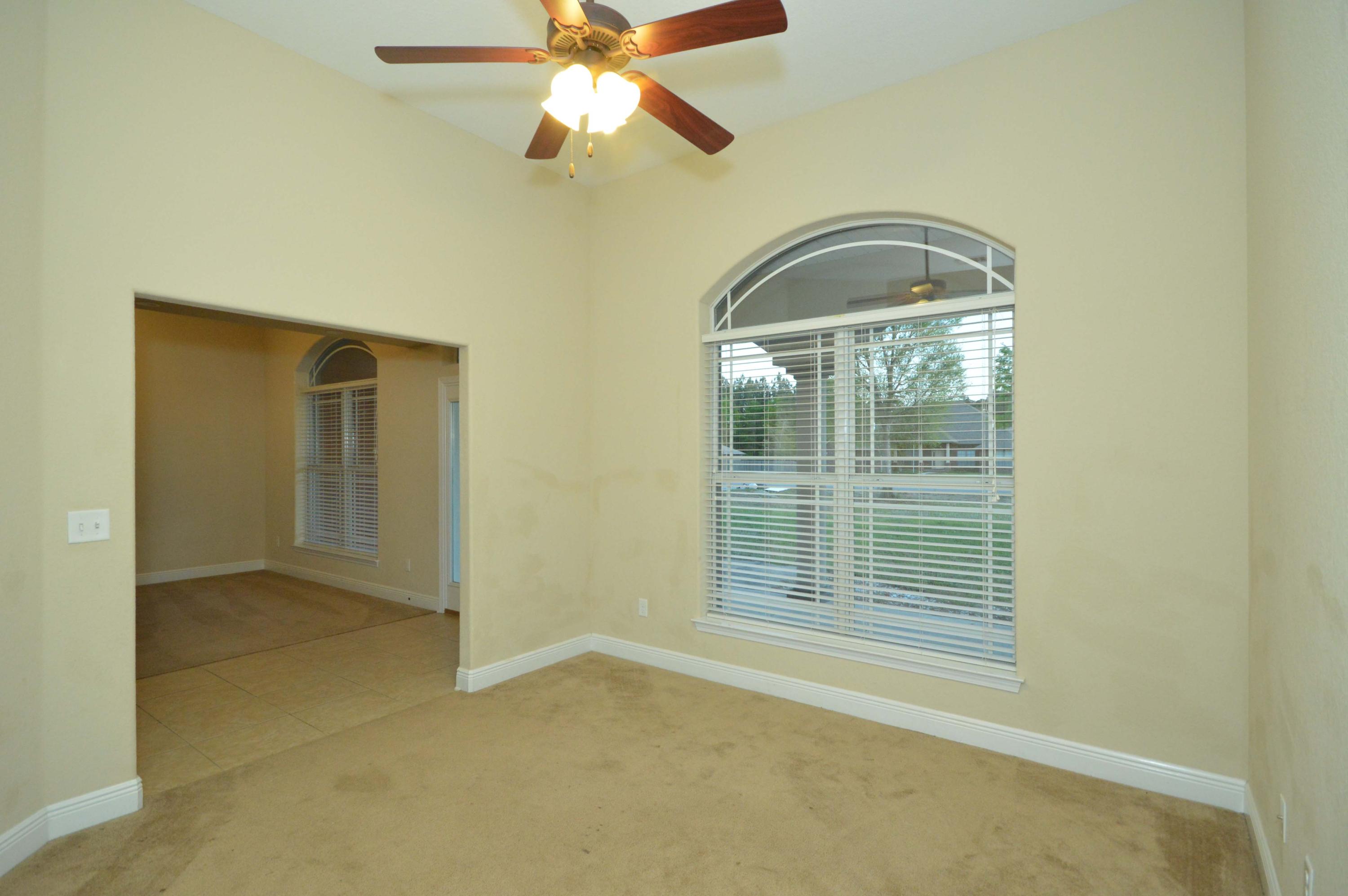 9970 Nichols Lake Road Milton, FL 32583 - Photo 17 of 48 an empty room with windows