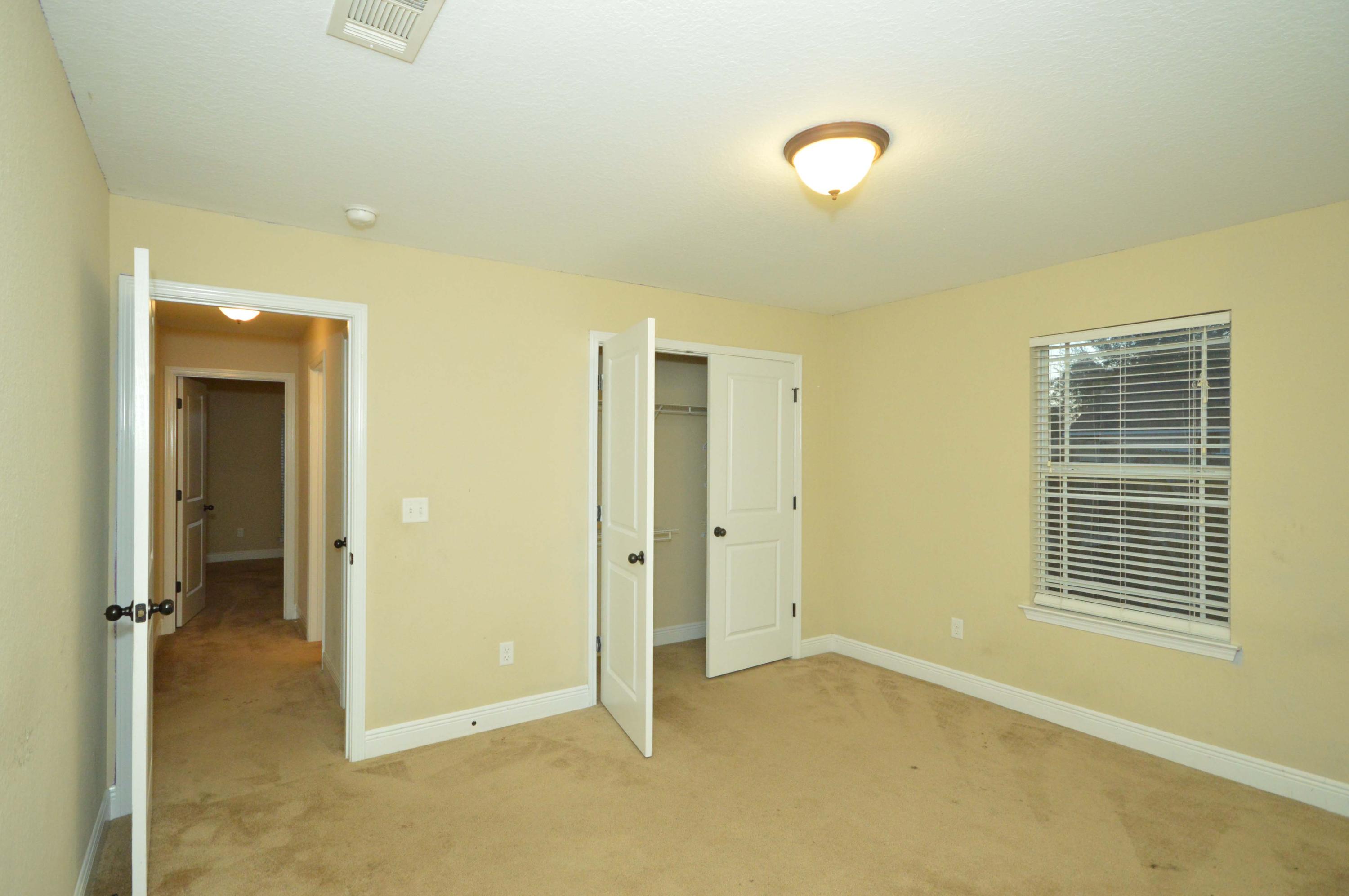 9970 Nichols Lake Road Milton, FL 32583 - Photo 28 of 48 a view of an empty room with a window