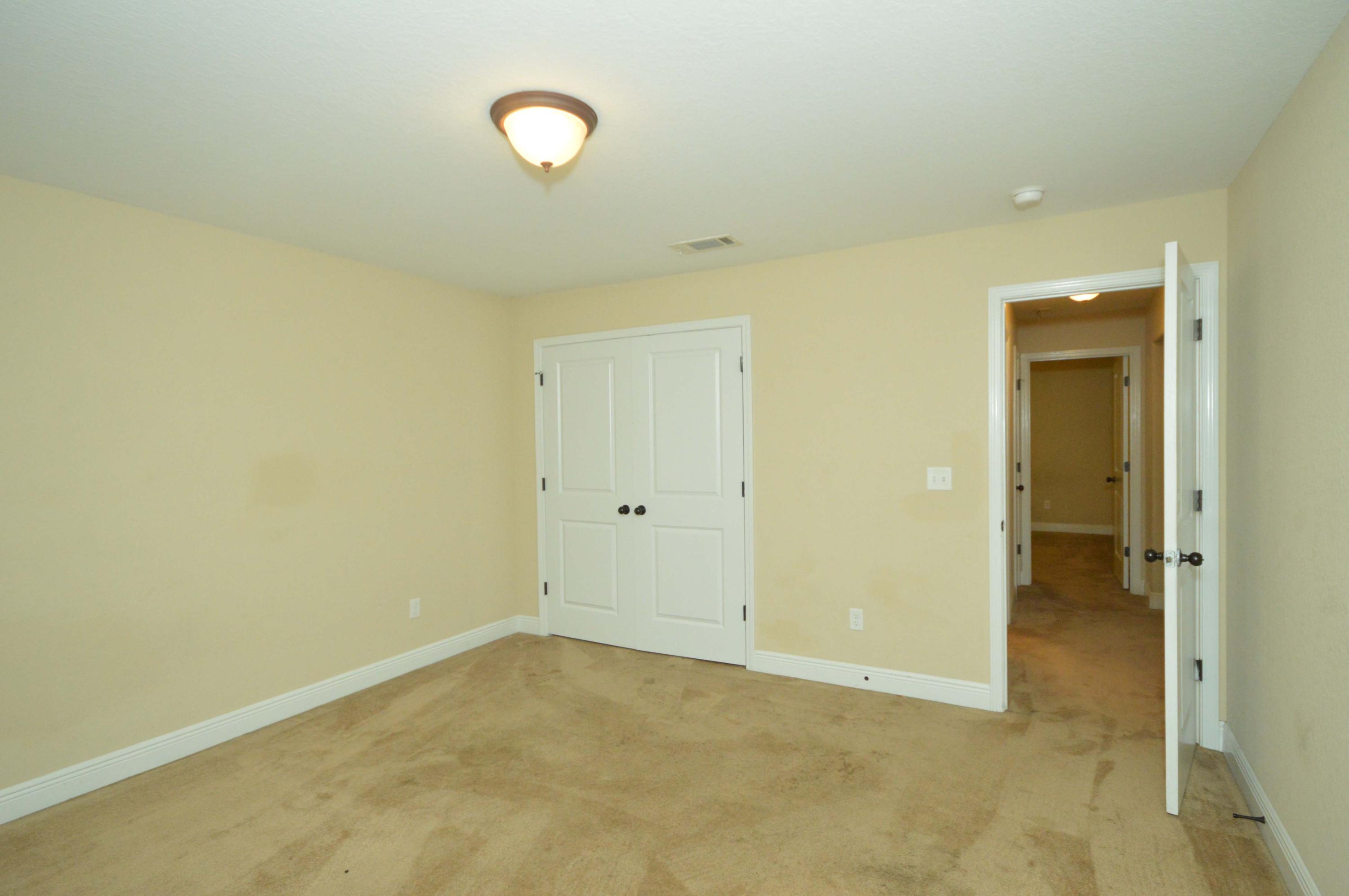 9970 Nichols Lake Road Milton, FL 32583 - Photo 29 of 48 an empty room and a mirror