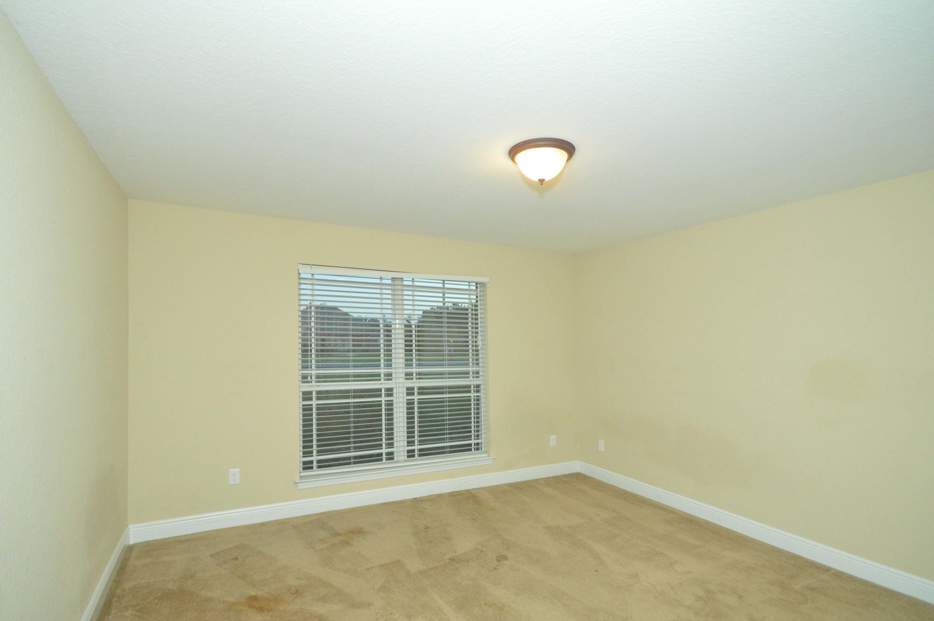 9970 Nichols Lake Road Milton, FL 32583 - Photo 30 of 48 an empty room with a window