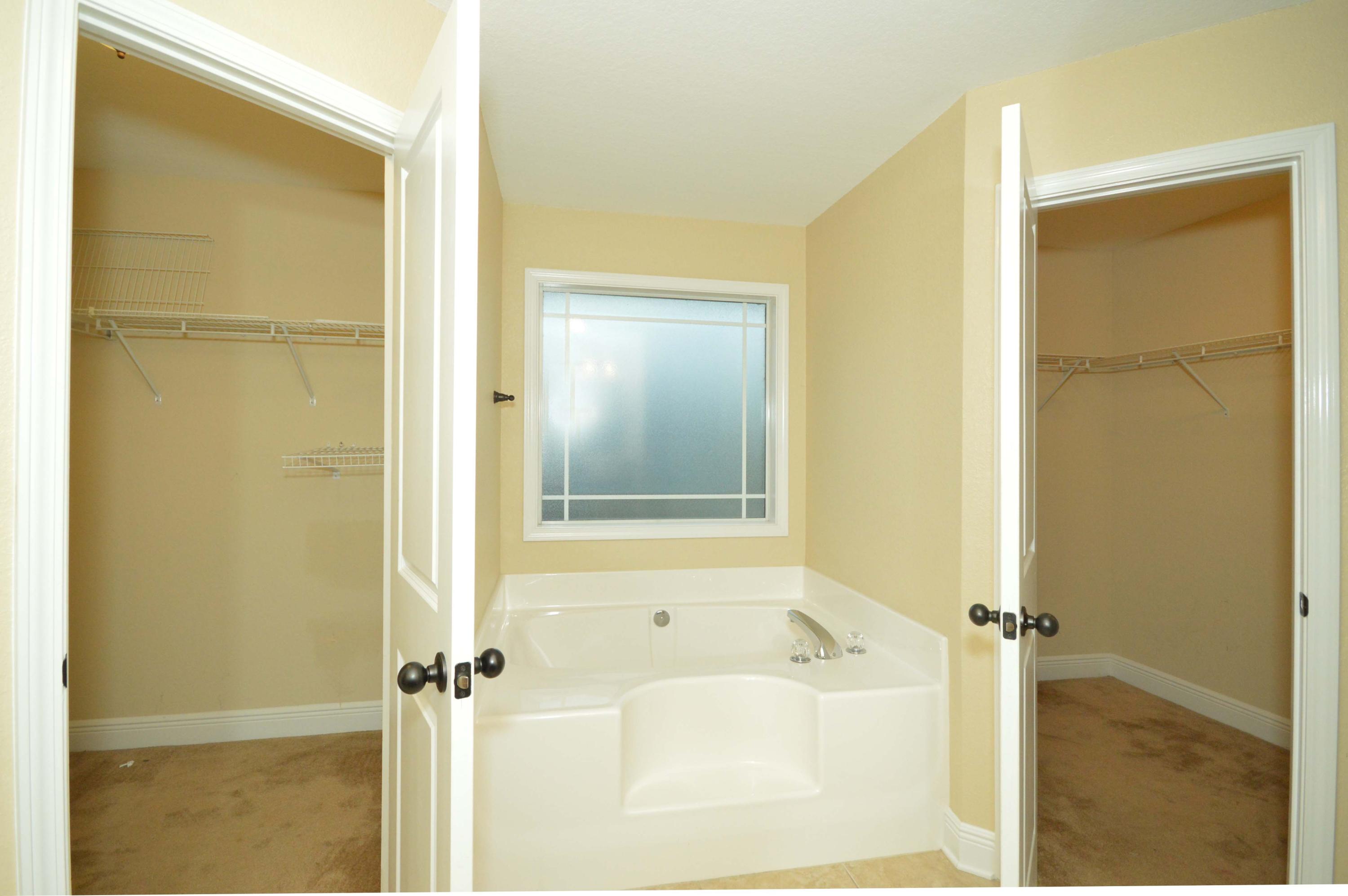 9970 Nichols Lake Road Milton, FL 32583 - Photo 35 of 48 a bathroom with a bathtub