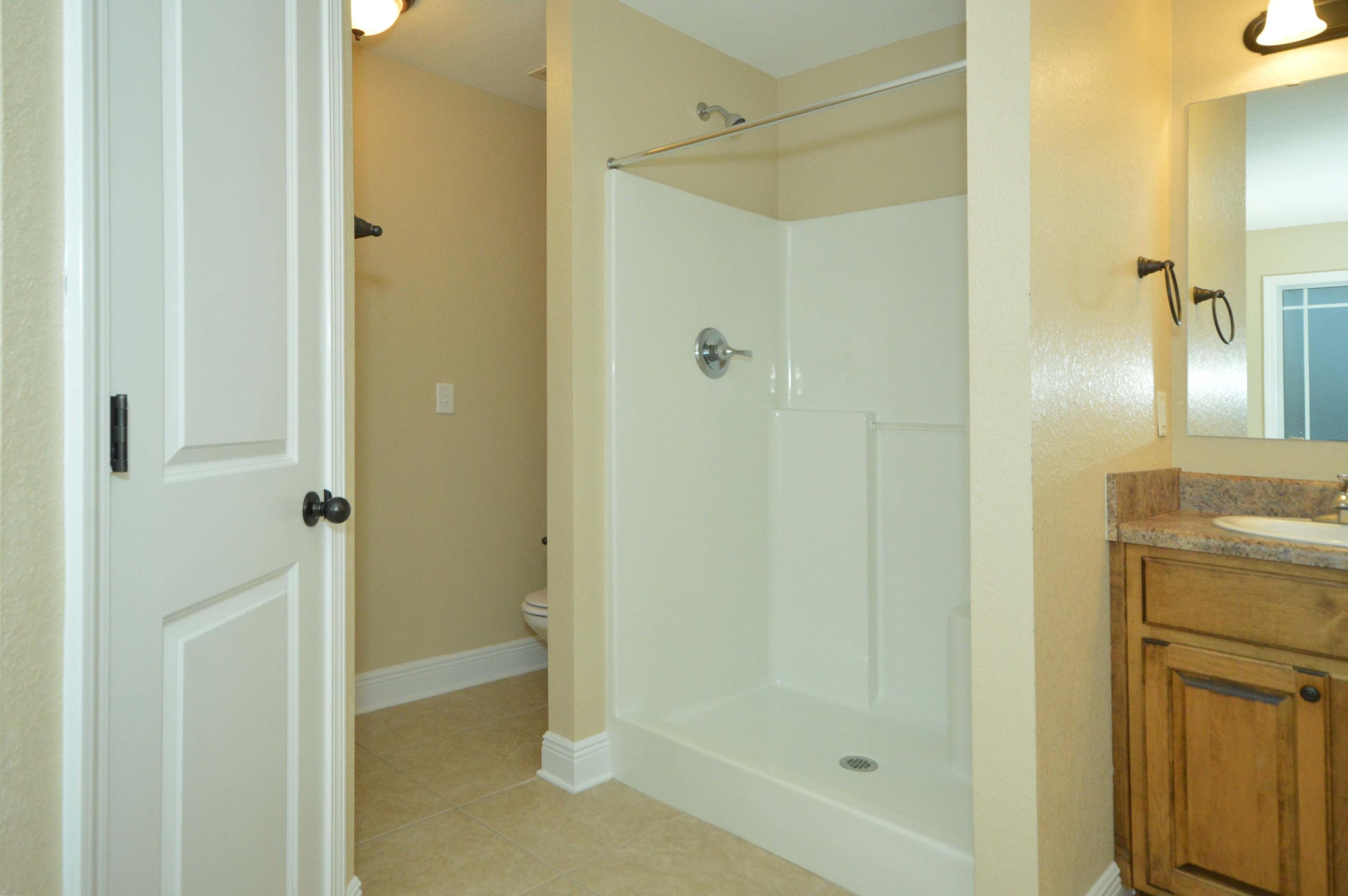 9970 Nichols Lake Road Milton, FL 32583 - Photo 40 of 48 a bathroom with a shower and a sink
