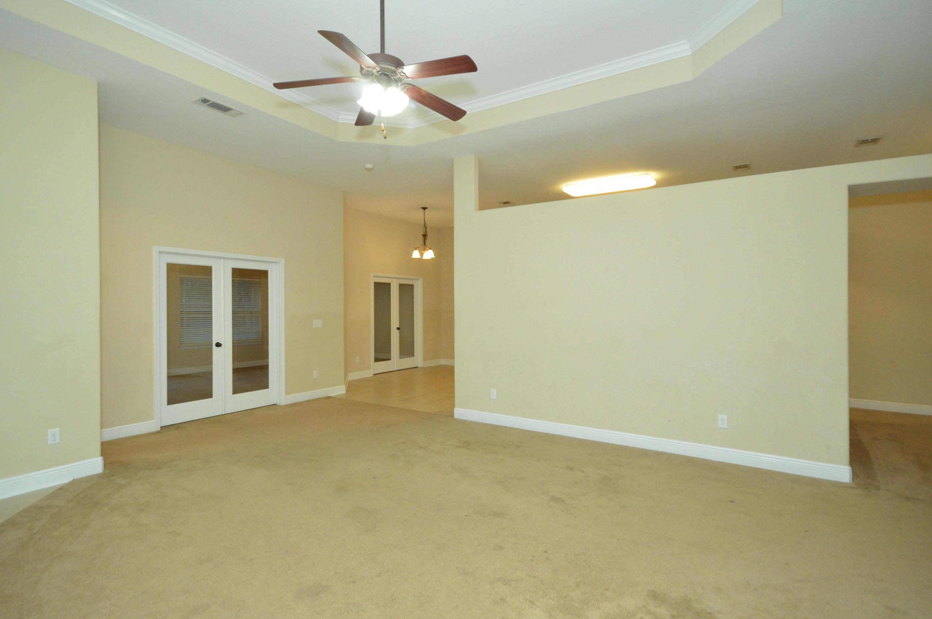 9970 Nichols Lake Road Milton, FL 32583 - Photo 7 of 48 a view of an empty room with a window