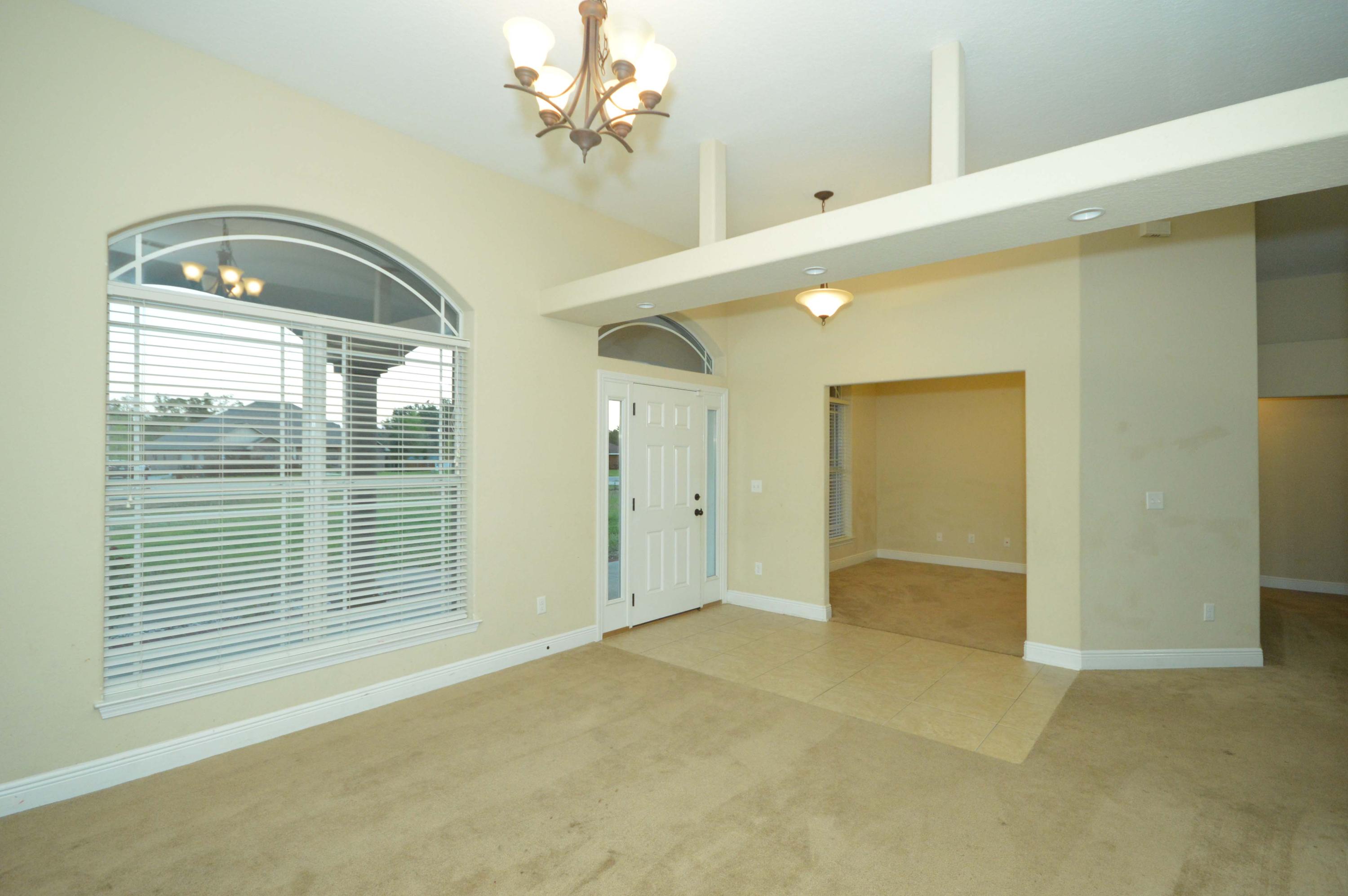 9970 Nichols Lake Road Milton, FL 32583 - Photo 10 of 48 a view of empty room with windows