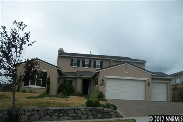 8532 Timaru Trail Reno, NV 89523 - Photo 1 of 1 a front view of a house with a yard
