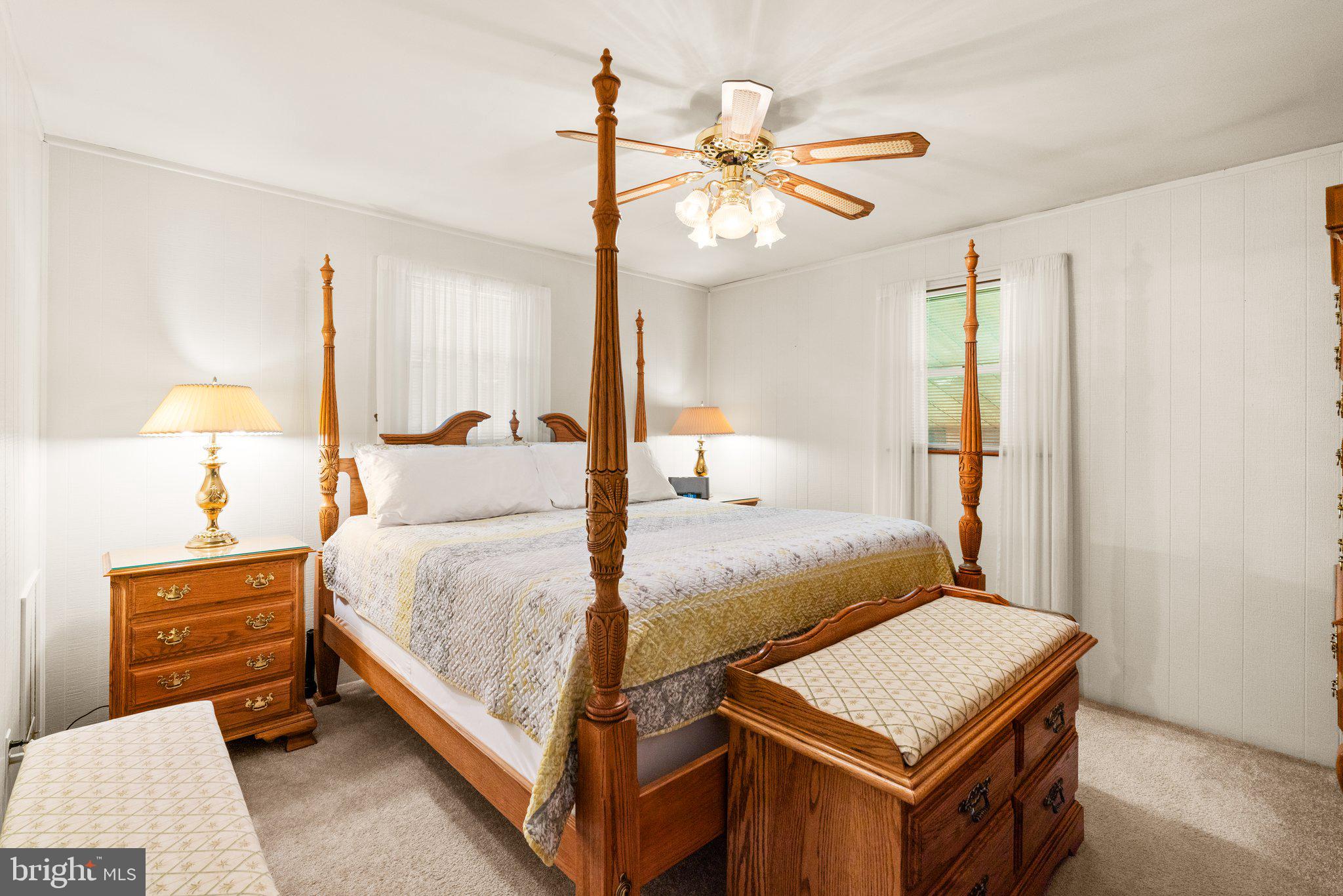 1814 Tyler Road Dundalk, MD 21222 - Photo 11 of 30 a bedroom with a bed a chandelier and a dresser