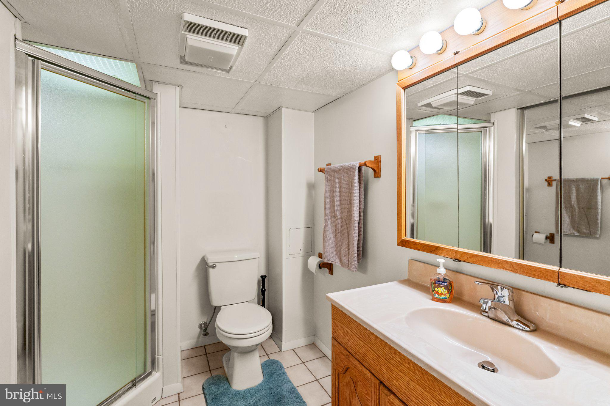 1814 Tyler Road Dundalk, MD 21222 - Photo 23 of 30 a bathroom with a sink toilet and shower