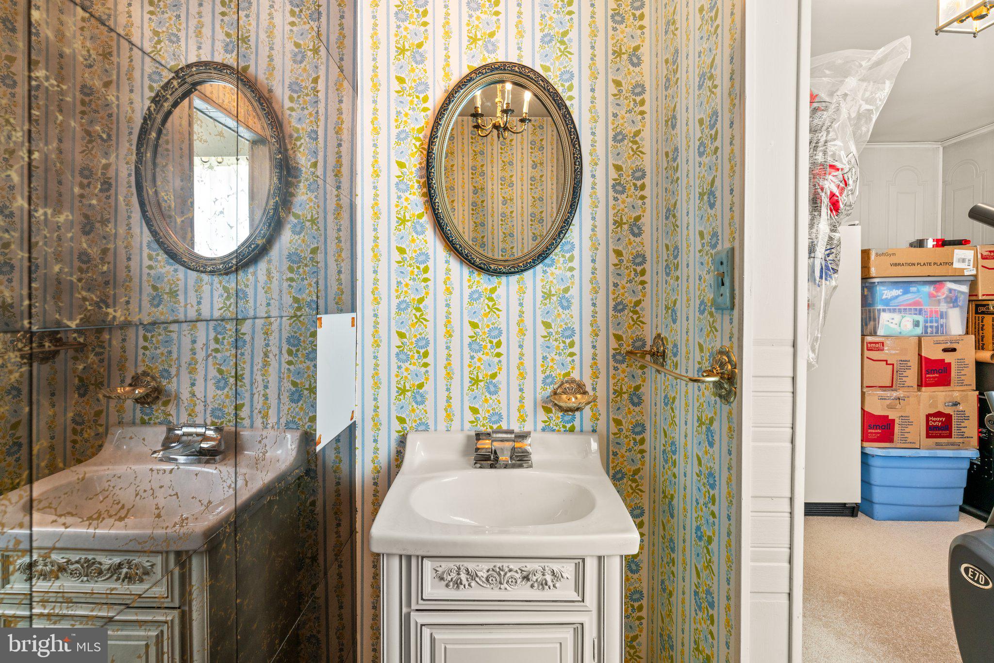 1814 Tyler Road Dundalk, MD 21222 - Photo 10 of 30 a bathroom with a sink and a mirror