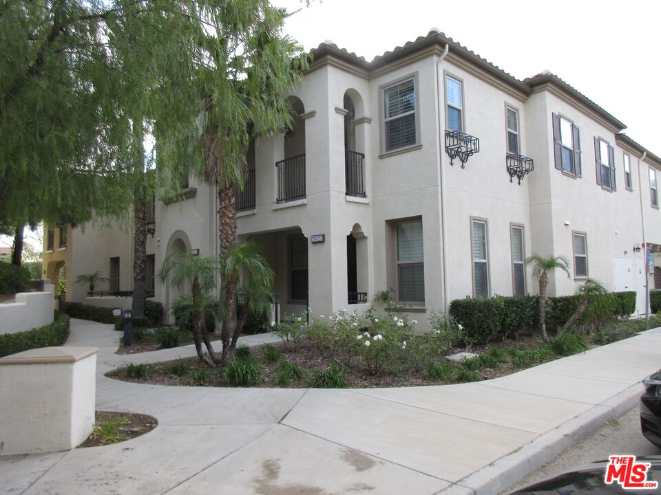 20427 Paseo Azul Porter Ranch, CA 91326 - Photo 1 of 38 a front view of a house with a garden