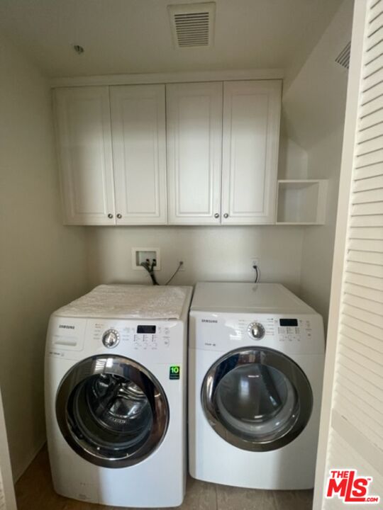 20427 Paseo Azul Porter Ranch, CA 91326 - Photo 24 of 38 a utility room with dryer and washer