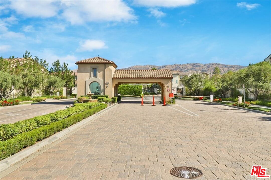 20427 Paseo Azul Porter Ranch, CA 91326 - Photo 3 of 38 a view of a street with a cars parked in front of it