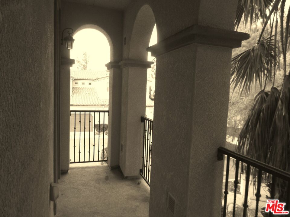 20427 Paseo Azul Porter Ranch, CA 91326 - Photo 33 of 38 a view of empty room with floor to ceiling window and wooden floor