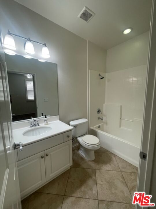 20427 Paseo Azul Porter Ranch, CA 91326 - Photo 37 of 38 a bathroom with a toilet sink and mirror