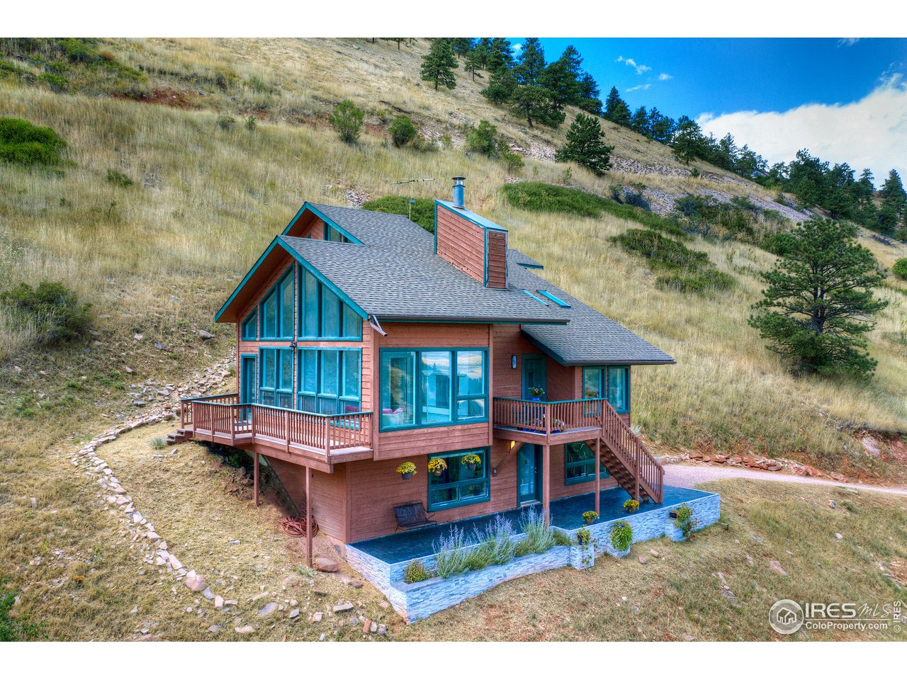 635 North Cedar Brook Road Boulder, CO 80304 - Photo 1 of 39 an aerial view of a house with a yard balcony