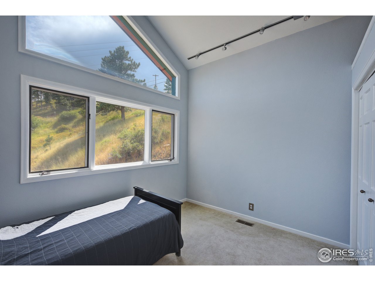 635 North Cedar Brook Road Boulder, CO 80304 - Photo 20 of 39 a view of an empty room with a window