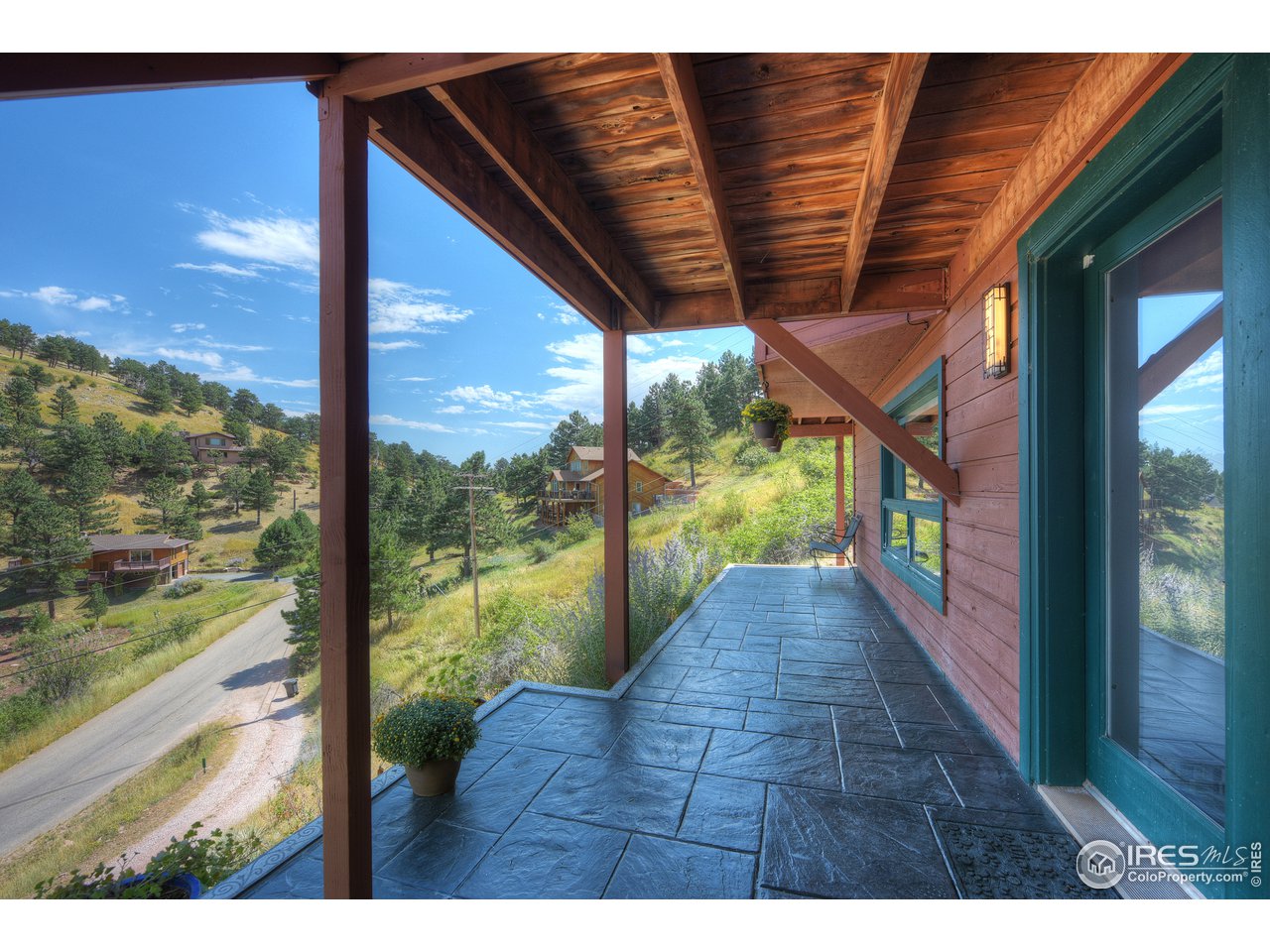 635 North Cedar Brook Road Boulder, CO 80304 - Photo 39 of 39 a view of a porch with wooden floor and outdoor space