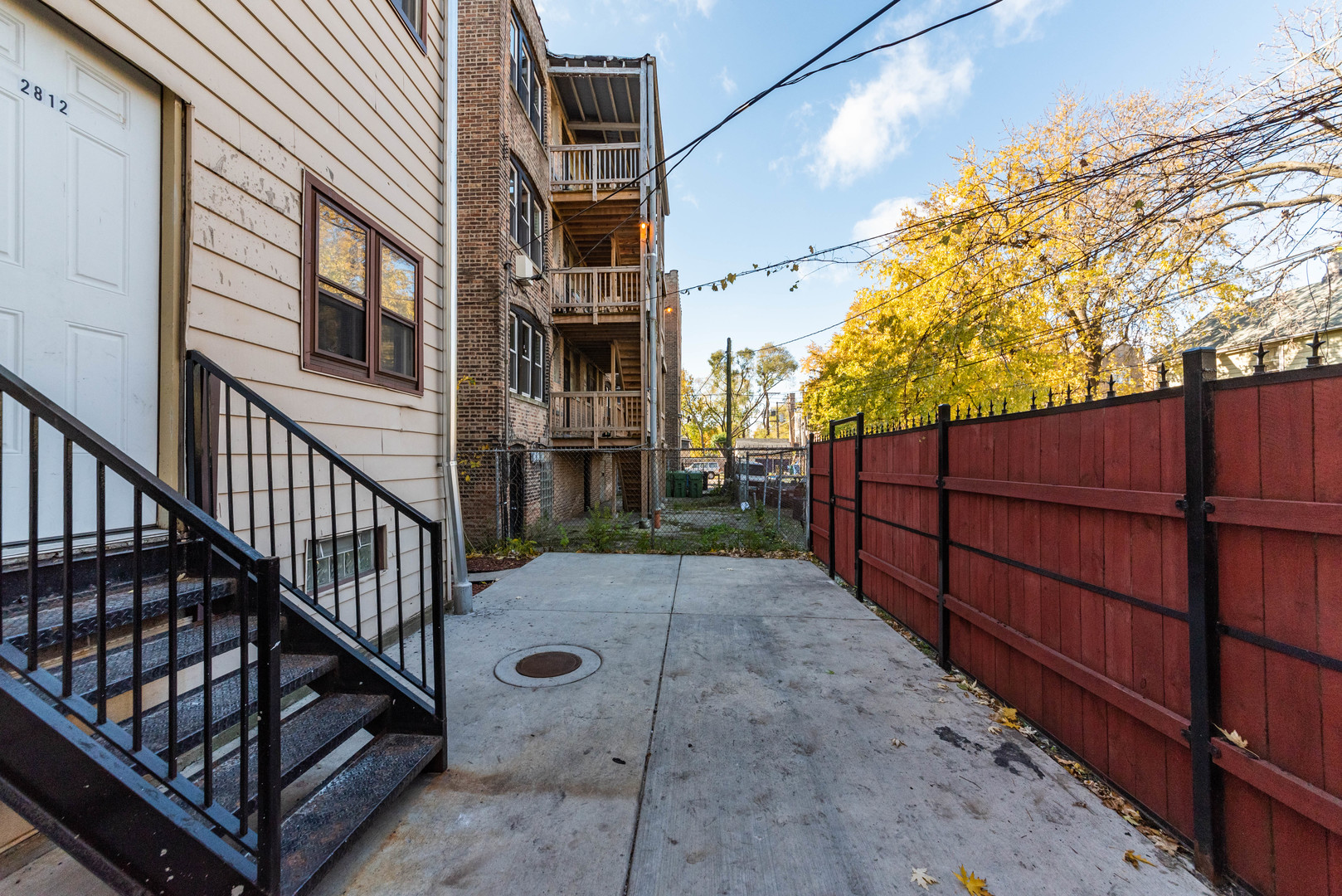 2812 East 76th Street, Unit 3 Chicago, IL 60649 - Photo 21 of 21 a view of entrance gate with wooden fence