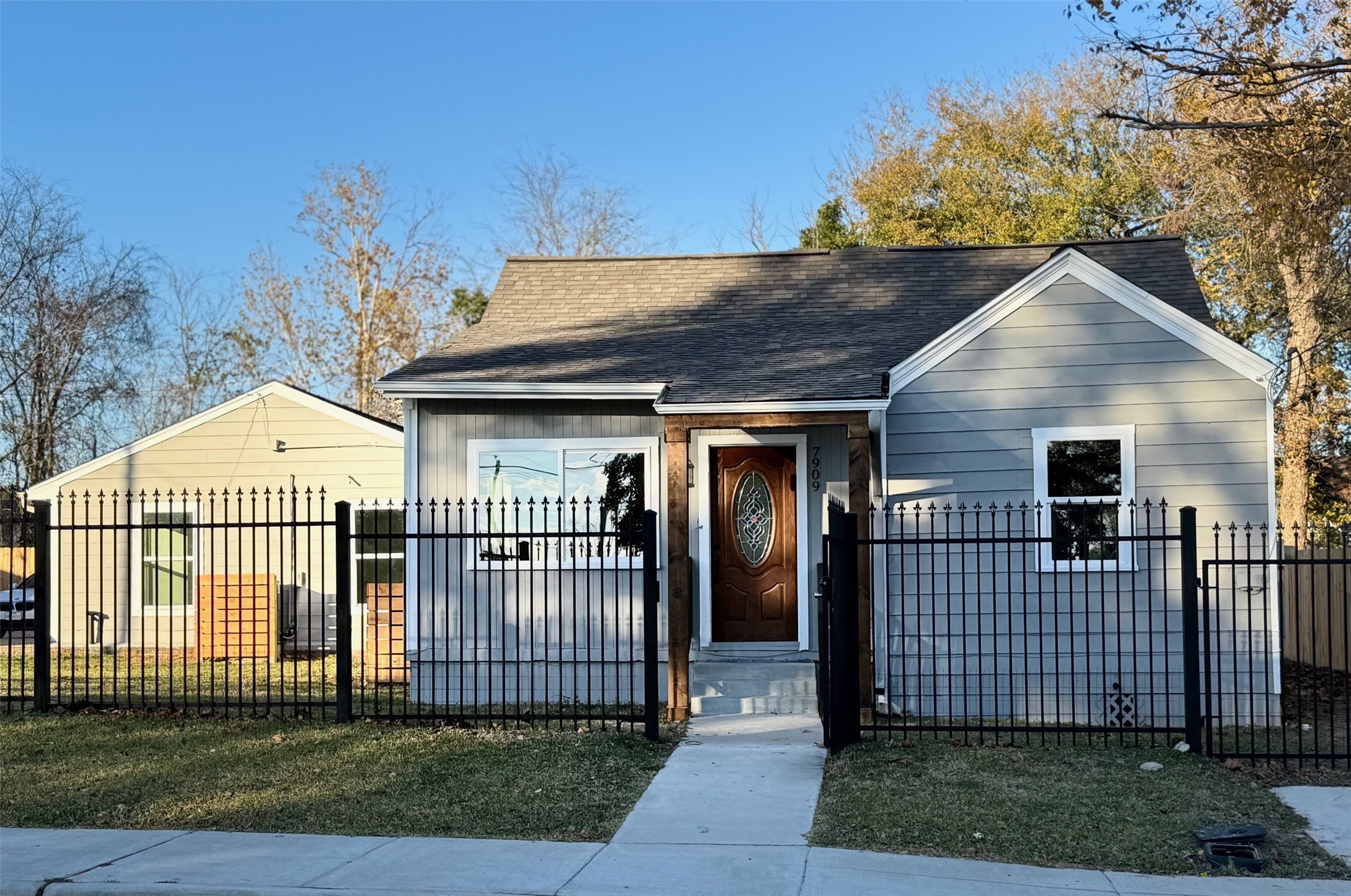 a front view of a house with a garden