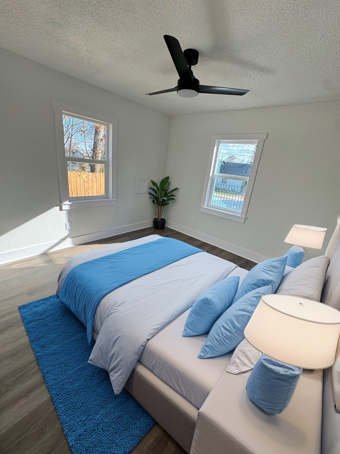 7909 Goode Street, Unit A Houston, TX 77012 - Photo 12 of 25 a bedroom with a bed and wooden floor