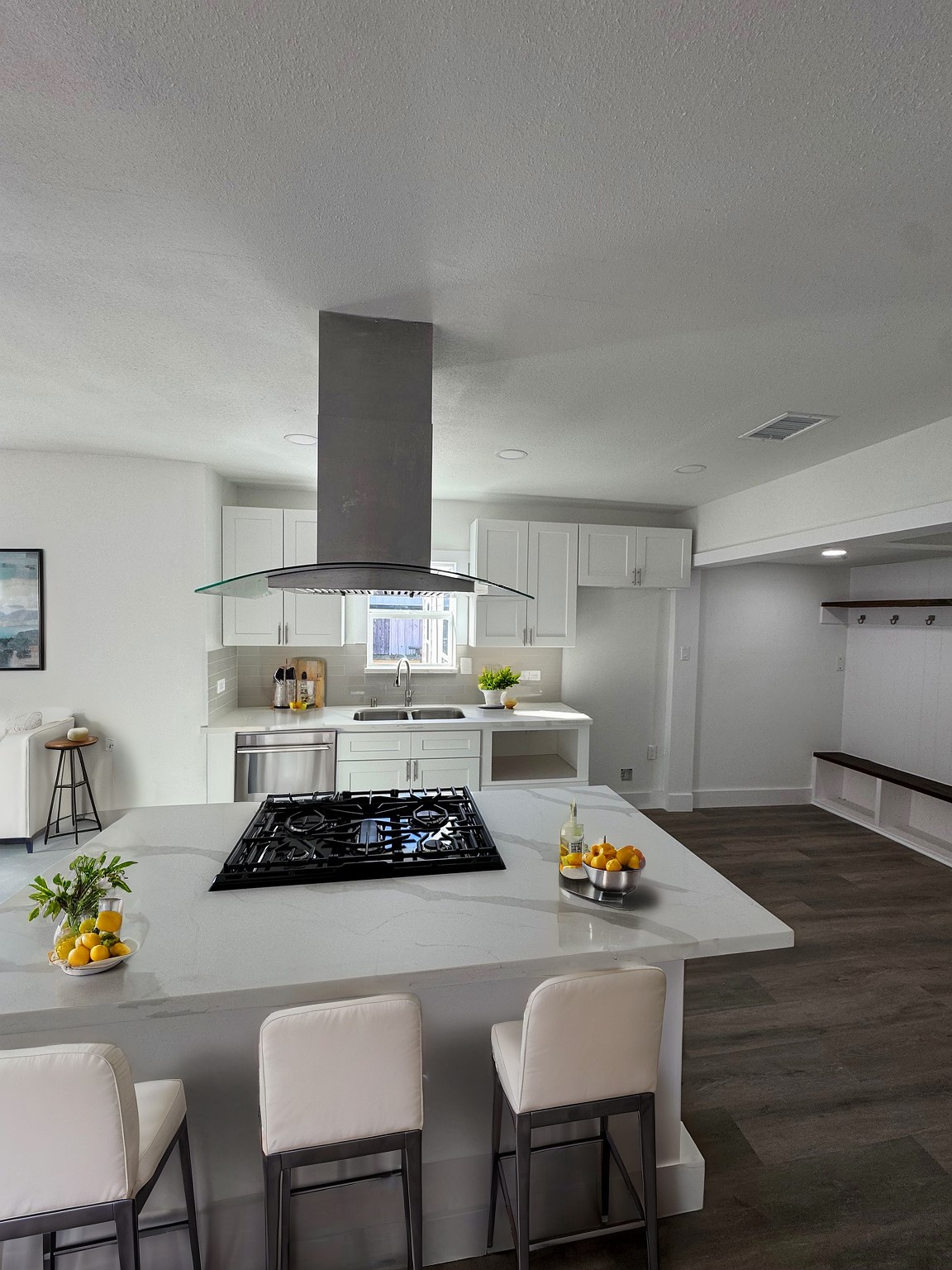 7909 Goode Street, Unit A Houston, TX 77012 - Photo 2 of 25 a kitchen with a stove a table and chairs in it