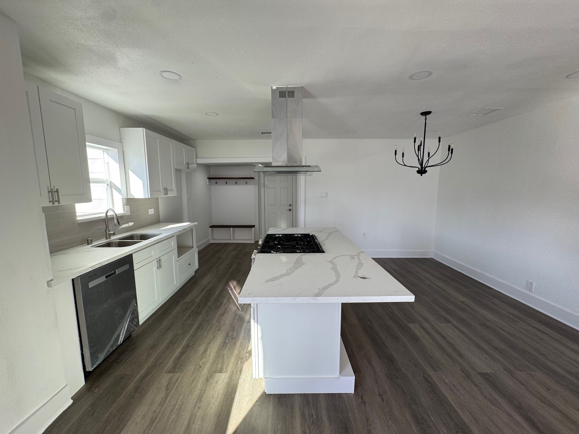 7909 Goode Street, Unit A Houston, TX 77012 - Photo 4 of 25 a kitchen with a sink appliances and cabinets