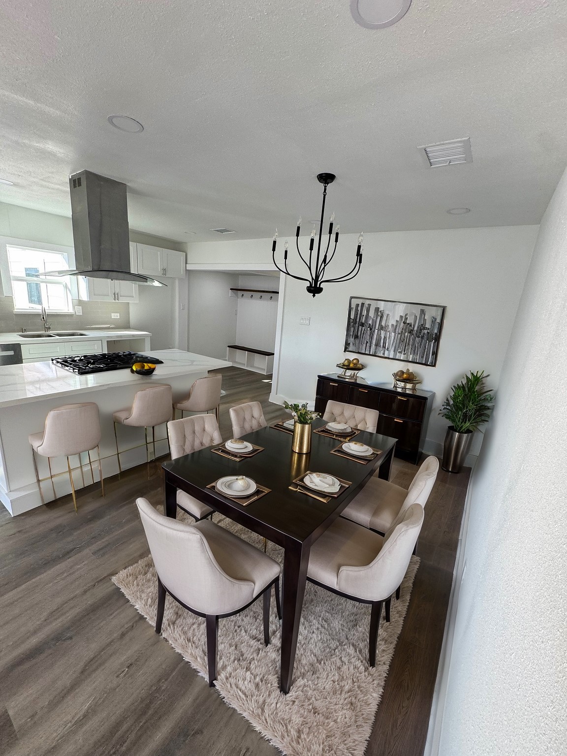 7909 Goode Street, Unit A Houston, TX 77012 - Photo 6 of 25 a kitchen with a table chairs stove and microwave