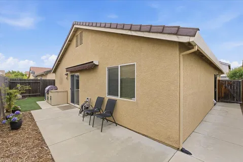 a patio with table and chairs
