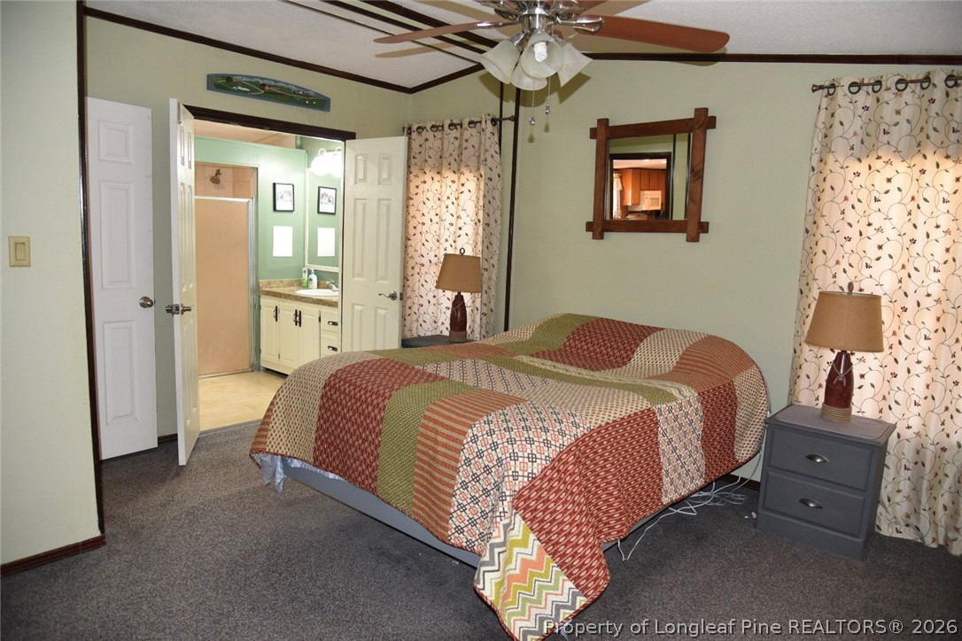 780 Old River Road Carthage, NC 28327 - Photo 11 of 28 a bedroom with bed and window