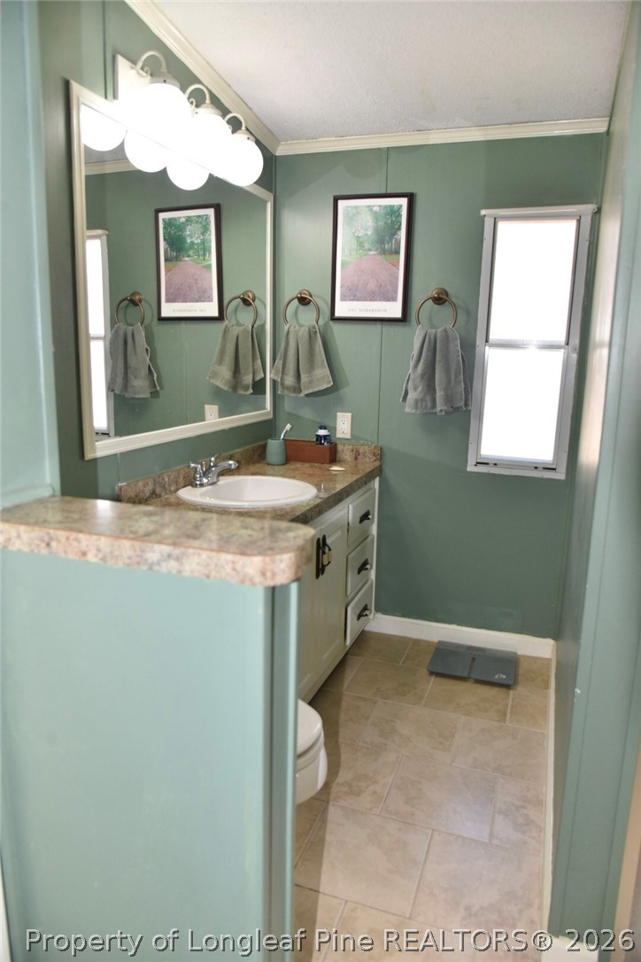 780 Old River Road Carthage, NC 28327 - Photo 14 of 28 a bathroom with a sink and a mirror