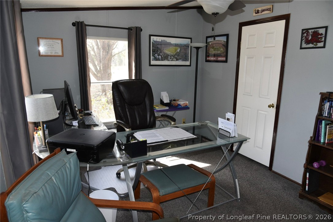 780 Old River Road Carthage, NC 28327 - Photo 18 of 28 a view of a workspace with furniture and a window
