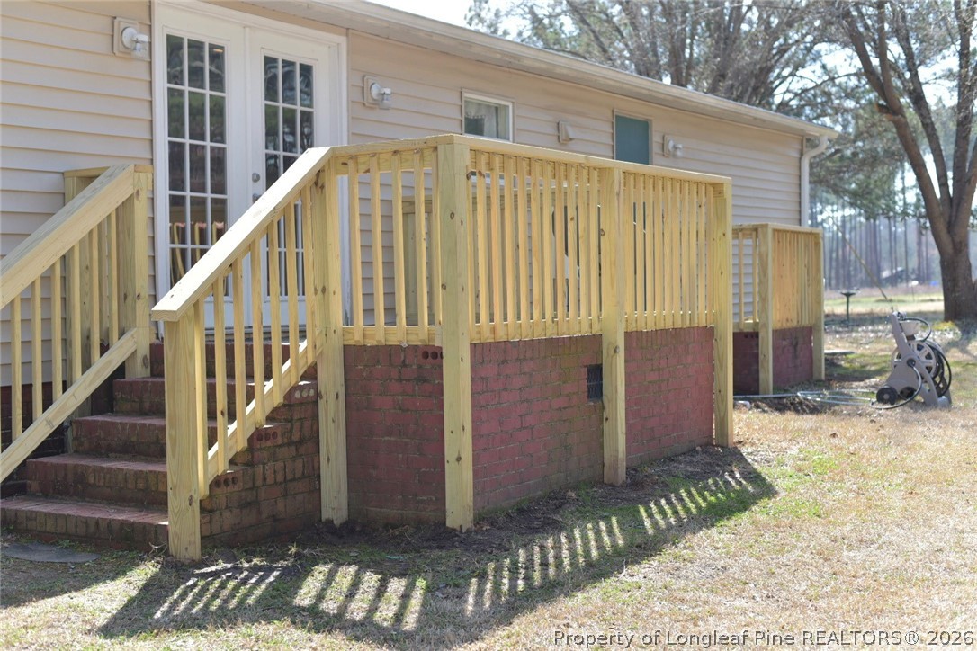 780 Old River Road Carthage, NC 28327 - Photo 24 of 28 a view of a house with wooden floor and a small yard