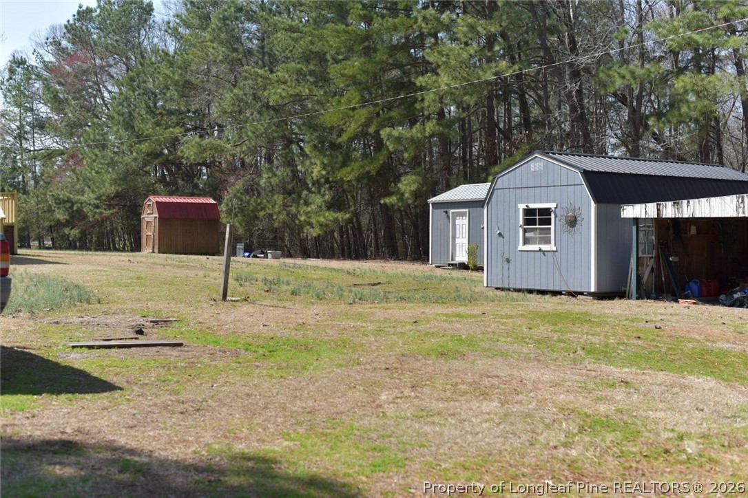 780 Old River Road Carthage, NC 28327 - Photo 27 of 28 a front view of a house with garden