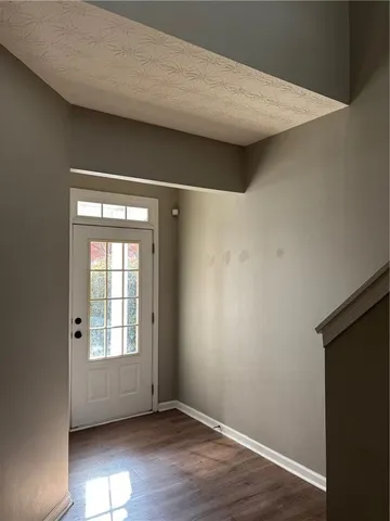 a kitchen with stainless steel appliances a stove a sink and a microwave