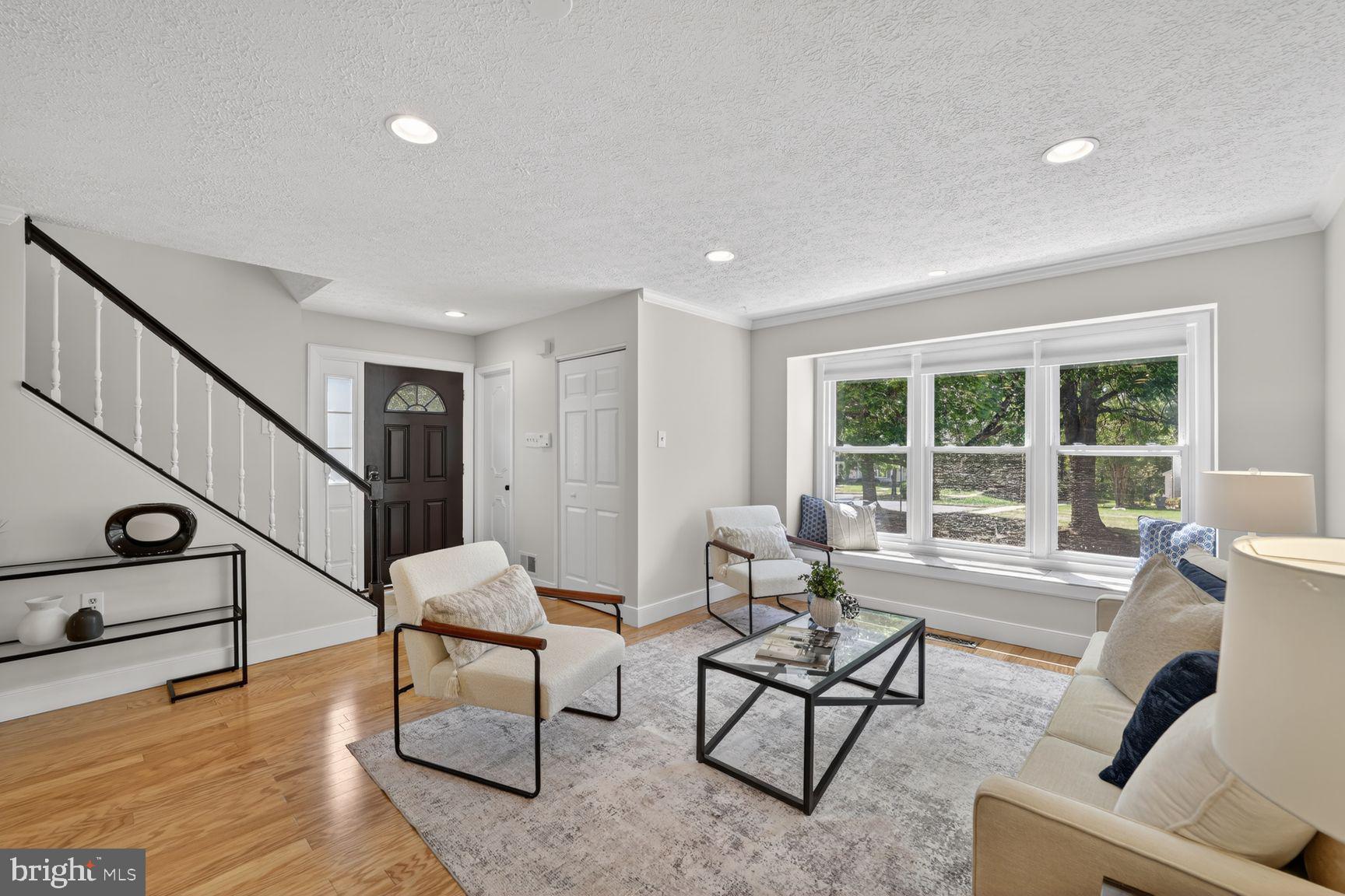 7265 Kousa Lane Springfield, VA 22152 - Photo 11 of 50 a living room with furniture and a window