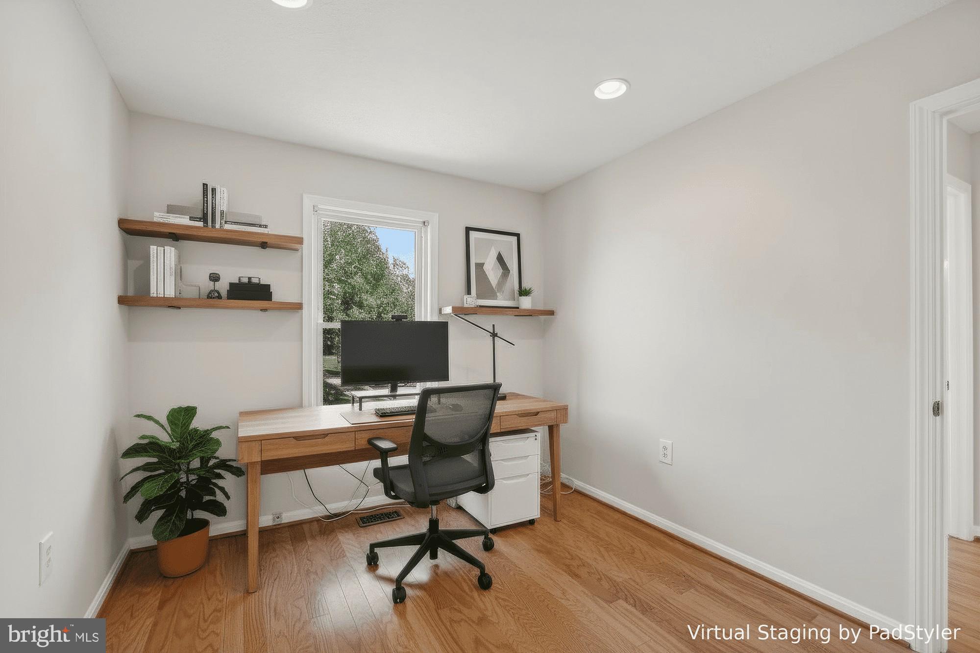 7265 Kousa Lane Springfield, VA 22152 - Photo 23 of 50 a view of a workspace with furniture and a window