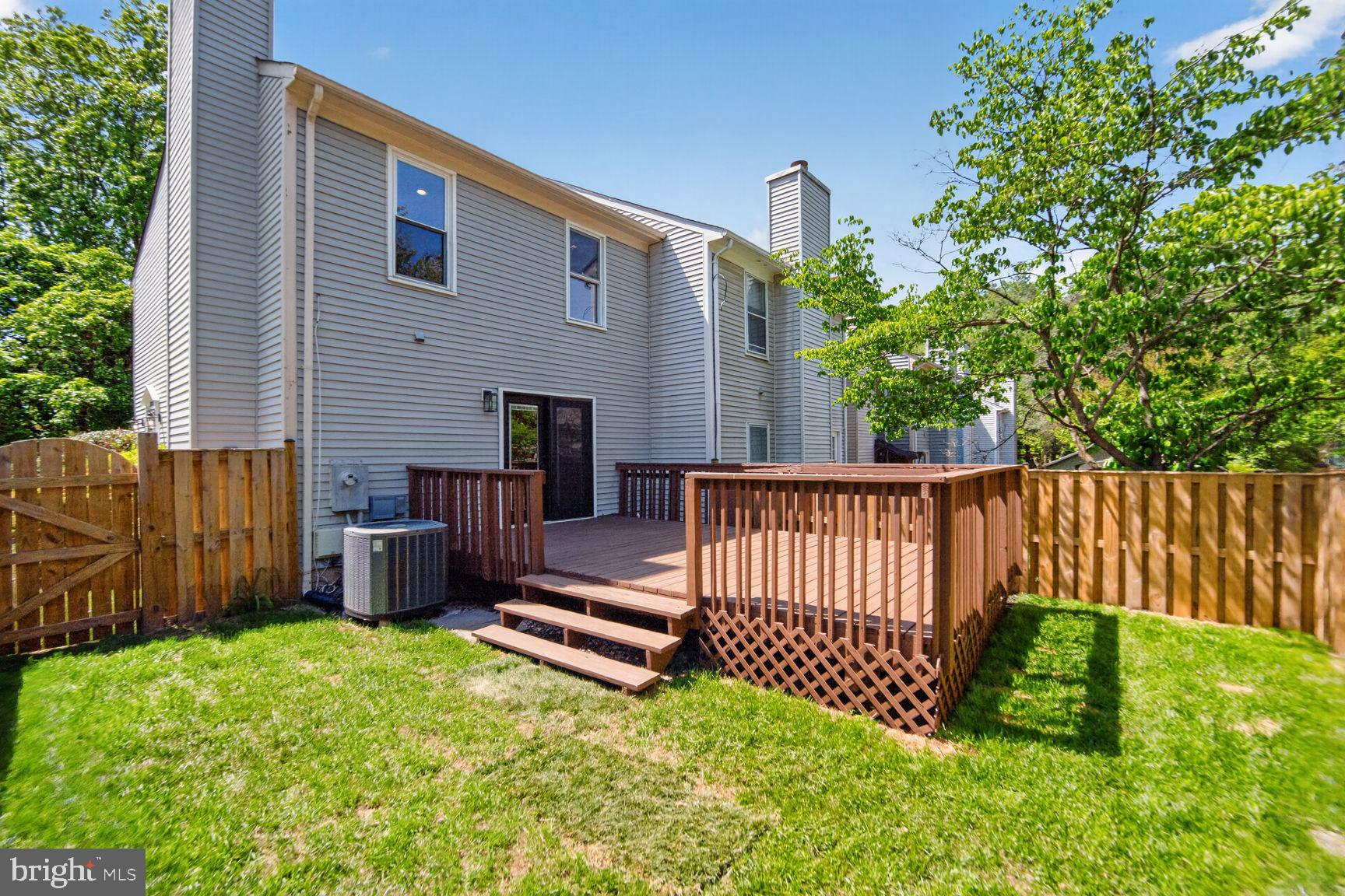 7265 Kousa Lane Springfield, VA 22152 - Photo 33 of 50 a view of a backyard with a fence