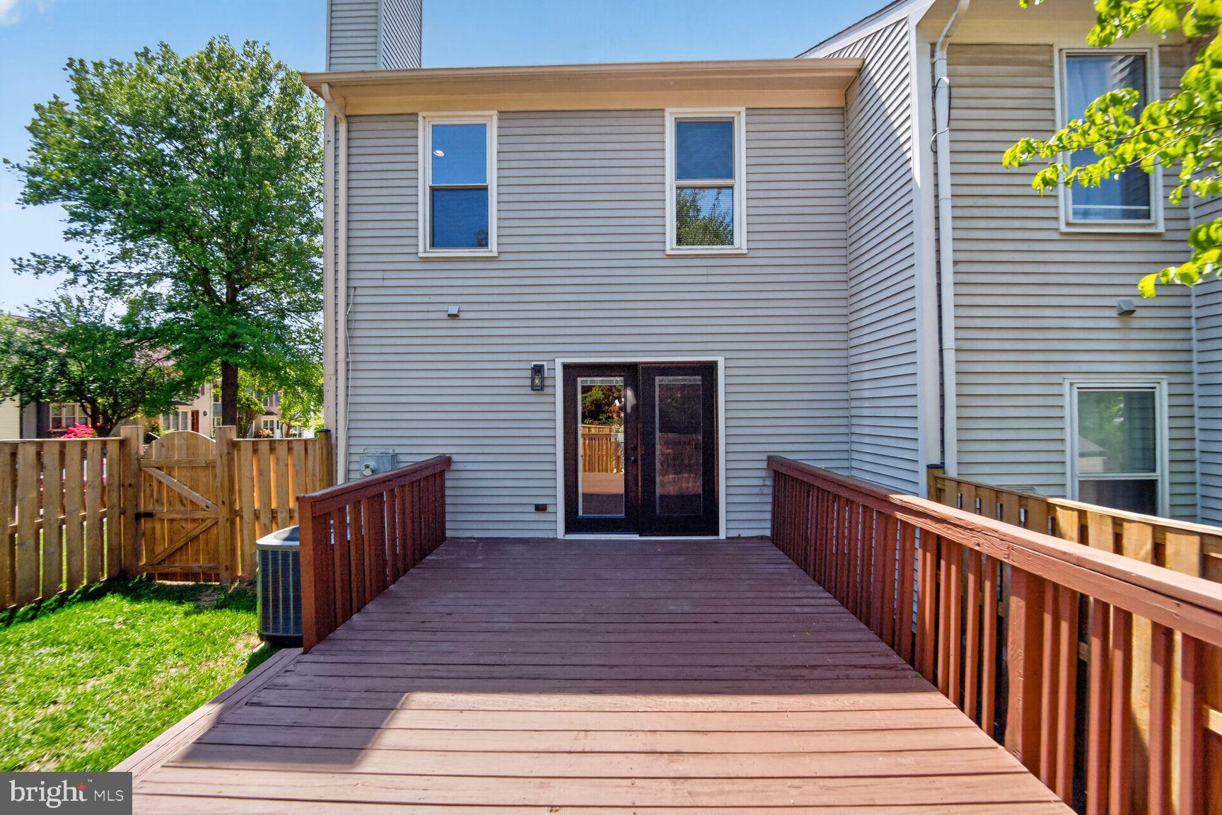 7265 Kousa Lane Springfield, VA 22152 - Photo 34 of 50 a view of a house with a deck