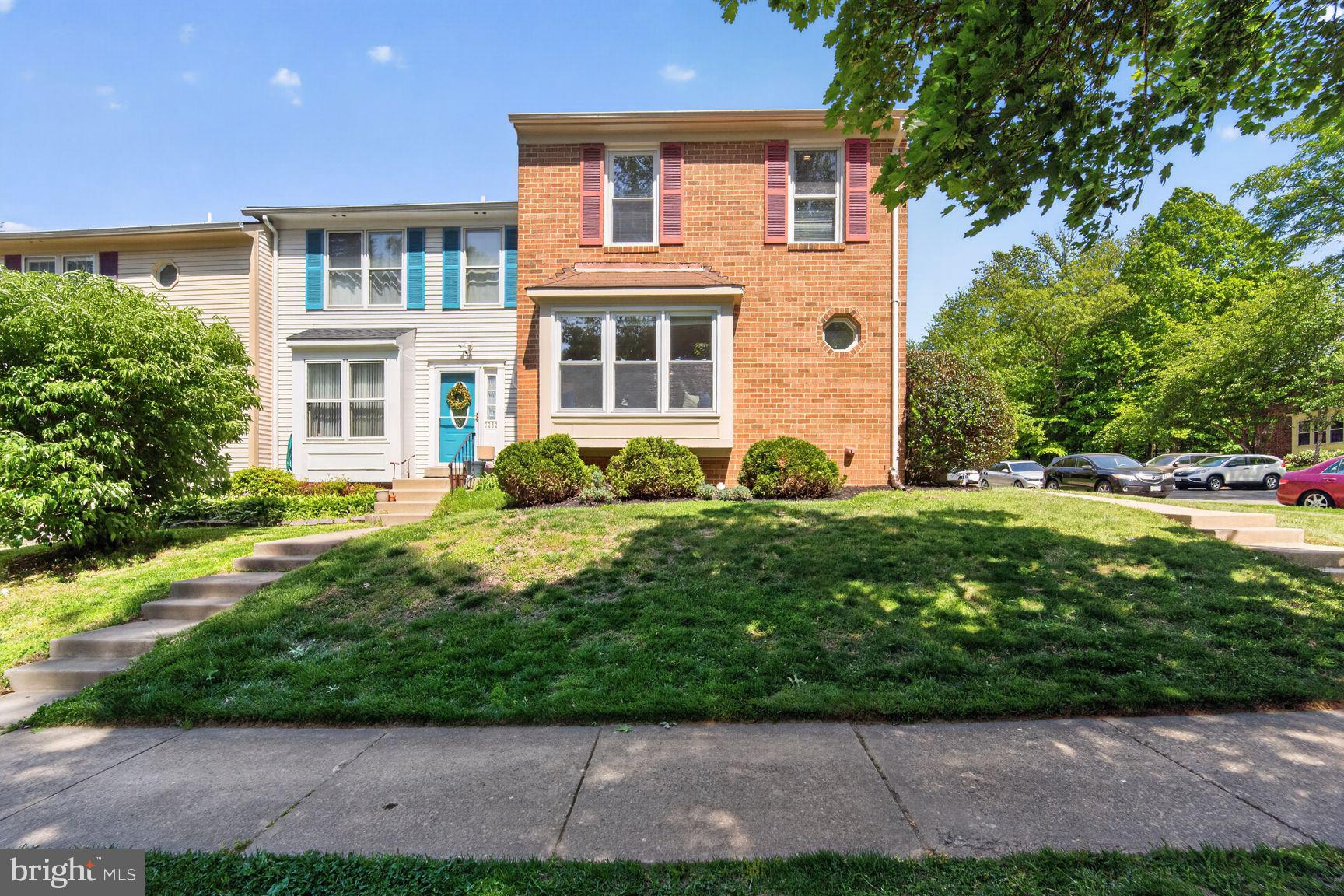 7265 Kousa Lane Springfield, VA 22152 - Photo 35 of 50 a front view of a house with garden