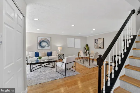 a living room with furniture and a table