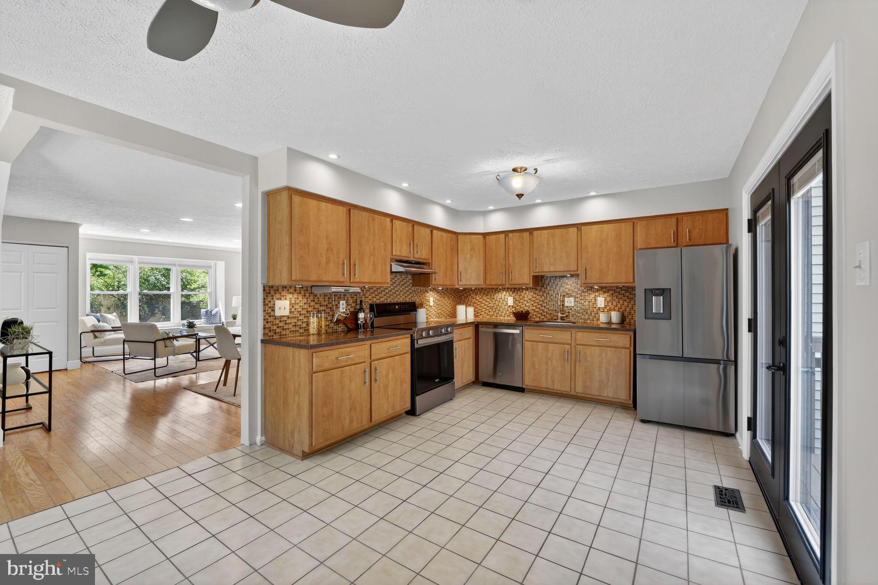 7265 Kousa Lane Springfield, VA 22152 - Photo 5 of 50 a kitchen with a sink appliances cabinets and furniture