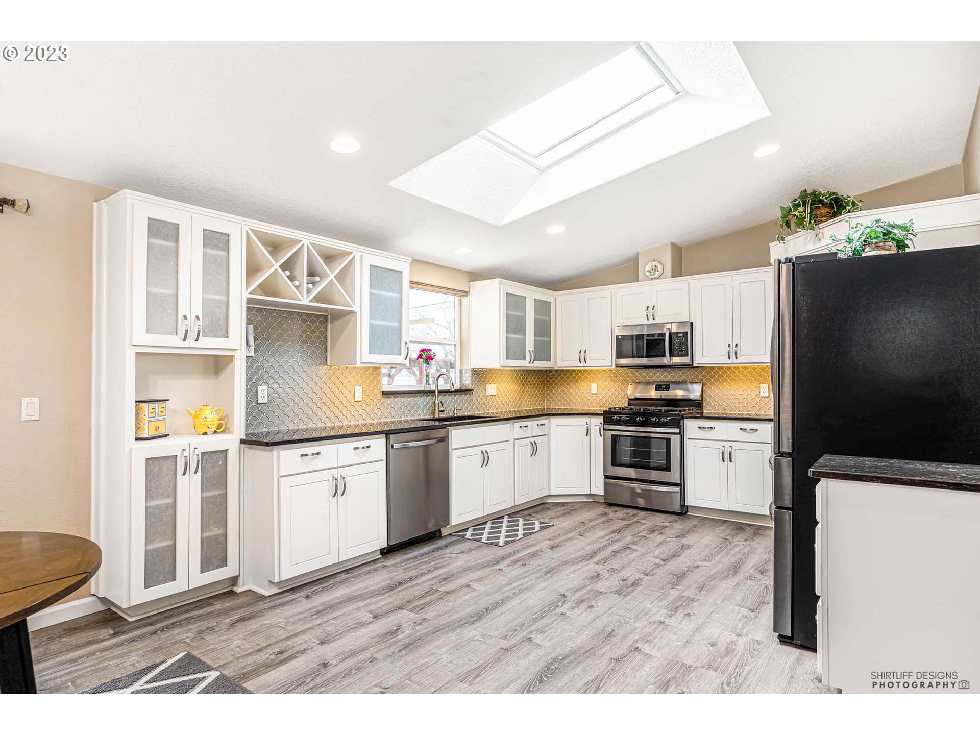 2458 Blue Boy Lane Eugene, OR 97404 - Photo 13 of 28 a kitchen with stainless steel appliances granite countertop a refrigerator sink and stove