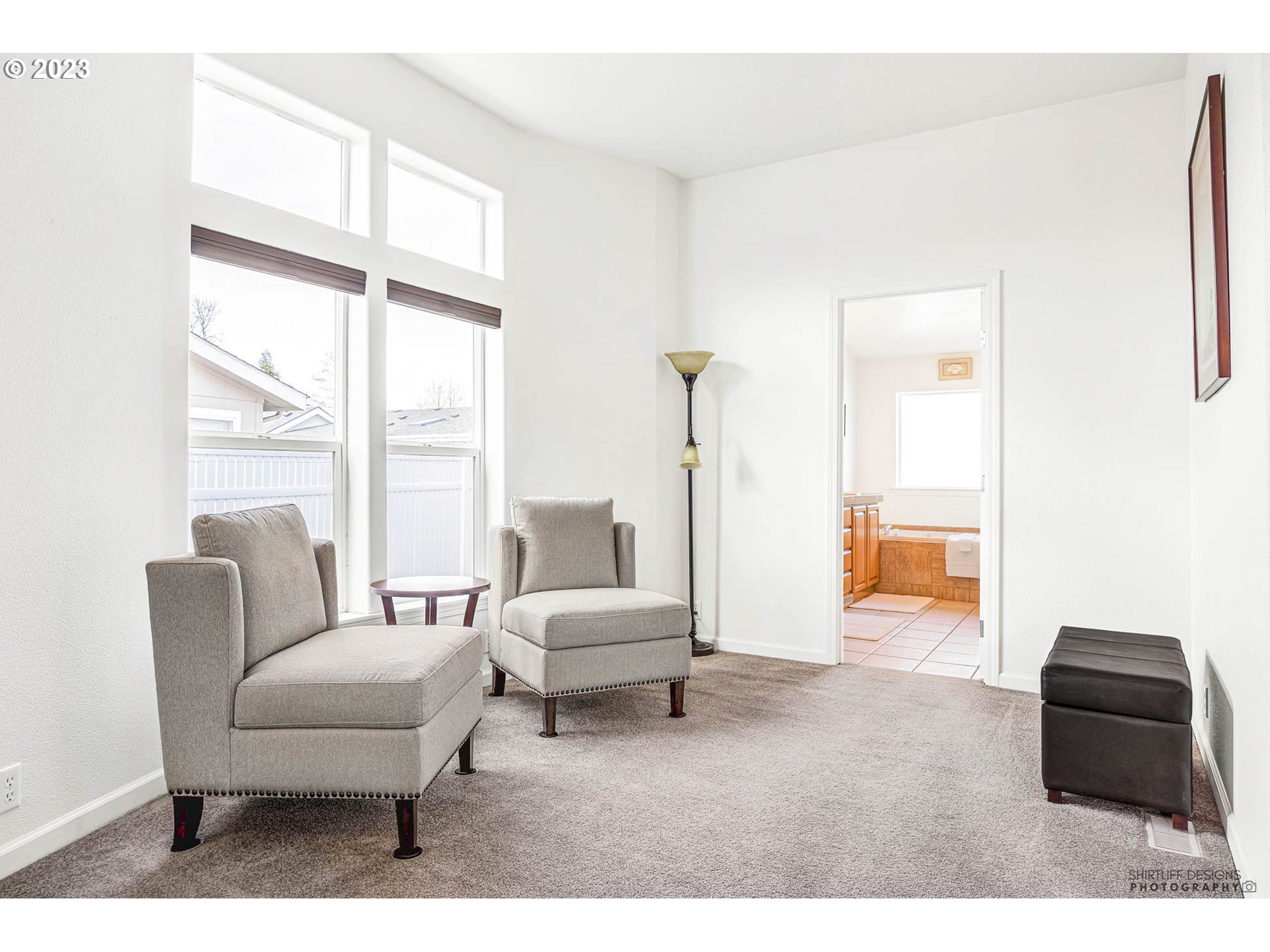 2458 Blue Boy Lane Eugene, OR 97404 - Photo 16 of 28 a living room with furniture and a large window